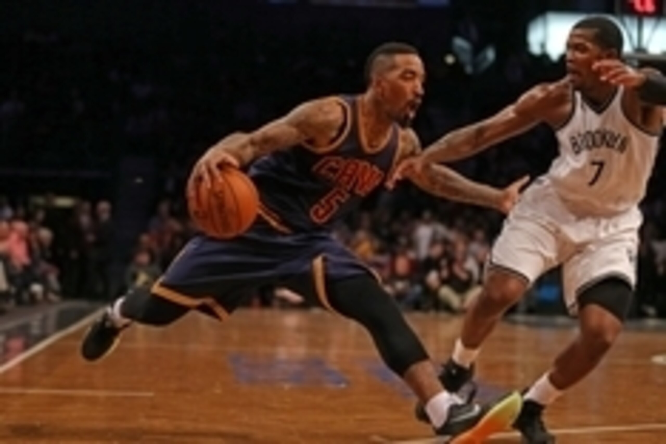 Mar 27, 2015; Brooklyn, NY, USA; Cleveland Cavaliers guard J.R. Smith (5) drives to the basket defended by Brooklyn Nets forward Joe Johnson (7) during the first half at Barclays Center. Mandatory Credit: Adam Hunger-USA TODAY Sports