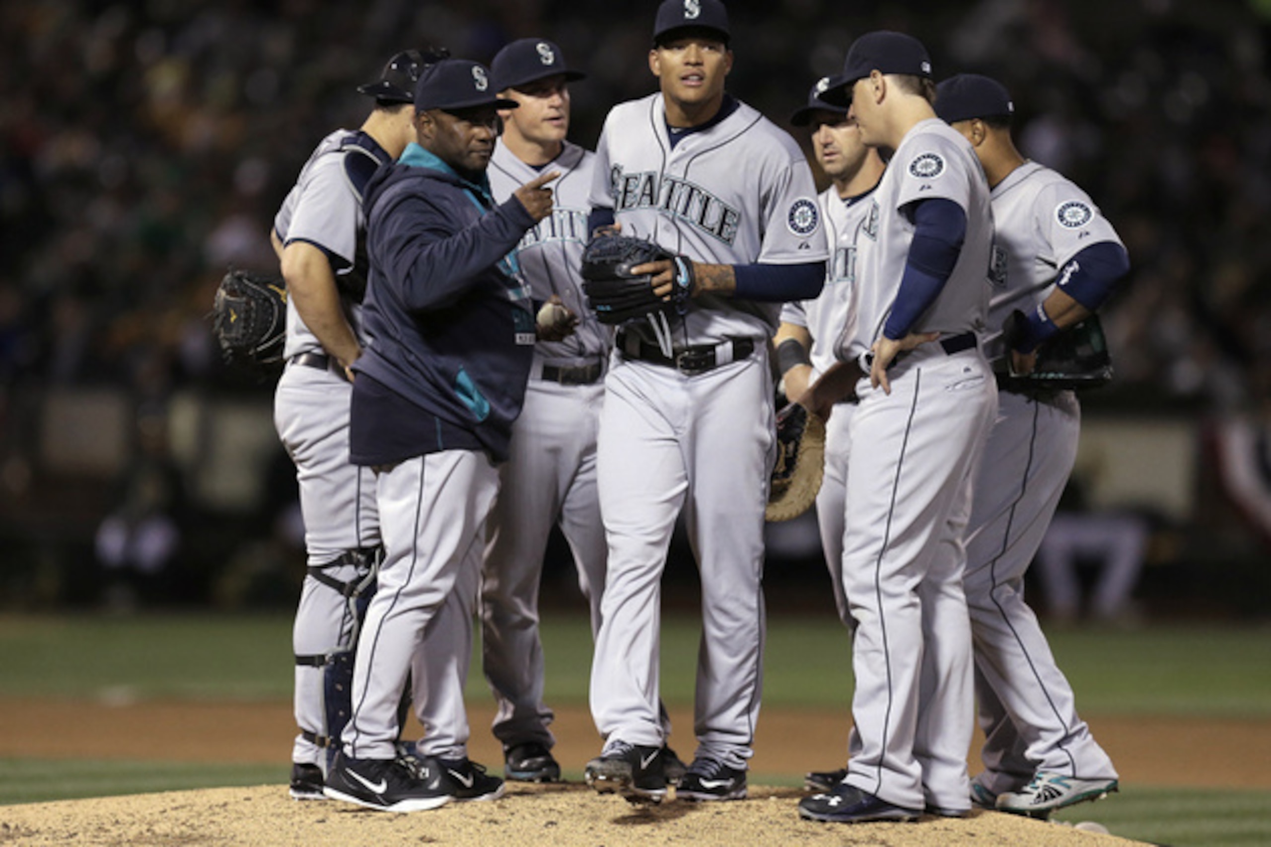 After giving up just two runs on 10 hits and five walks in 27 spring innings, Taijuan Walker (center) has allowed 14 earned on 15 hits and six walks in 7.1 frames.