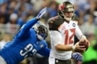 Dec 7, 2014; Detroit, MI, USA; Detroit Lions defensive end George Johnson (93) sacks Tampa Bay Buccaneers quarterback Josh McCown (12) during the second quarter at Ford Field. Mandatory Credit: Andrew Weber-USA TODAY Sports