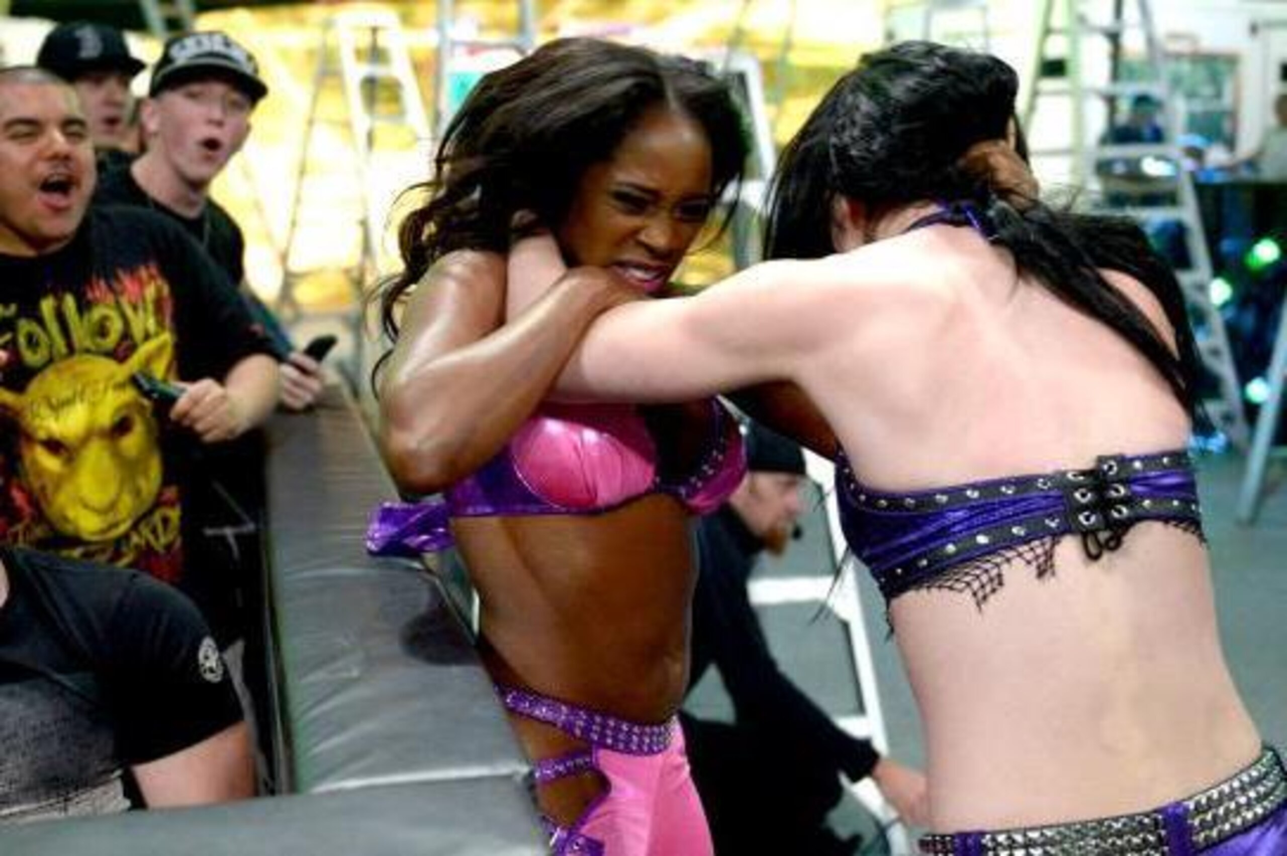 Naomi and Paige brawl outside the ring.