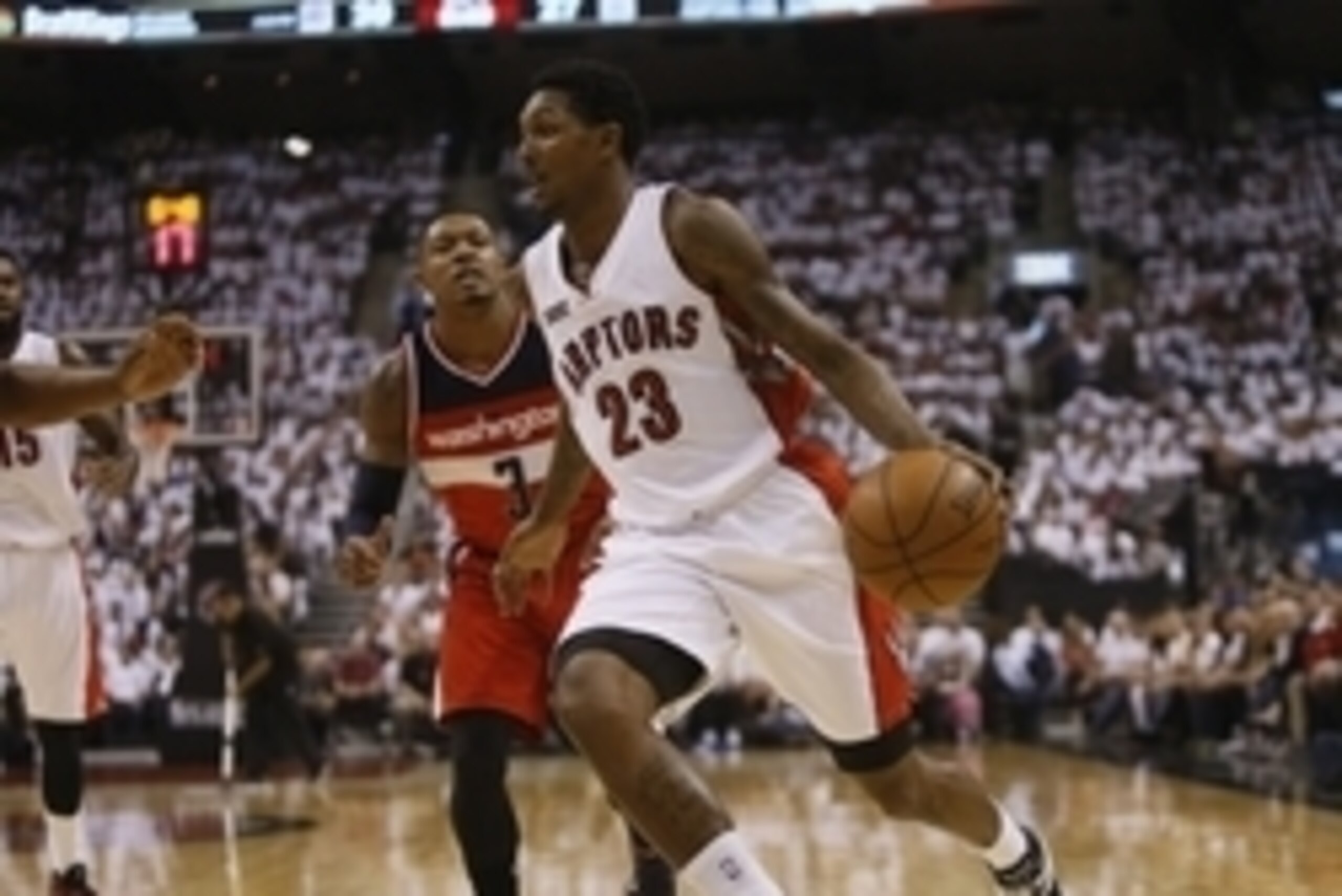 Apr 18, 2015; Toronto, Ontario, CAN; Toronto Raptors guard Louis Williams (23) drives to the net past Washington Wizards guard Bradley Beal (3) during the first half in game one of the first round of the NBA Playoffs at Air Canada Centre. Mandatory Credit