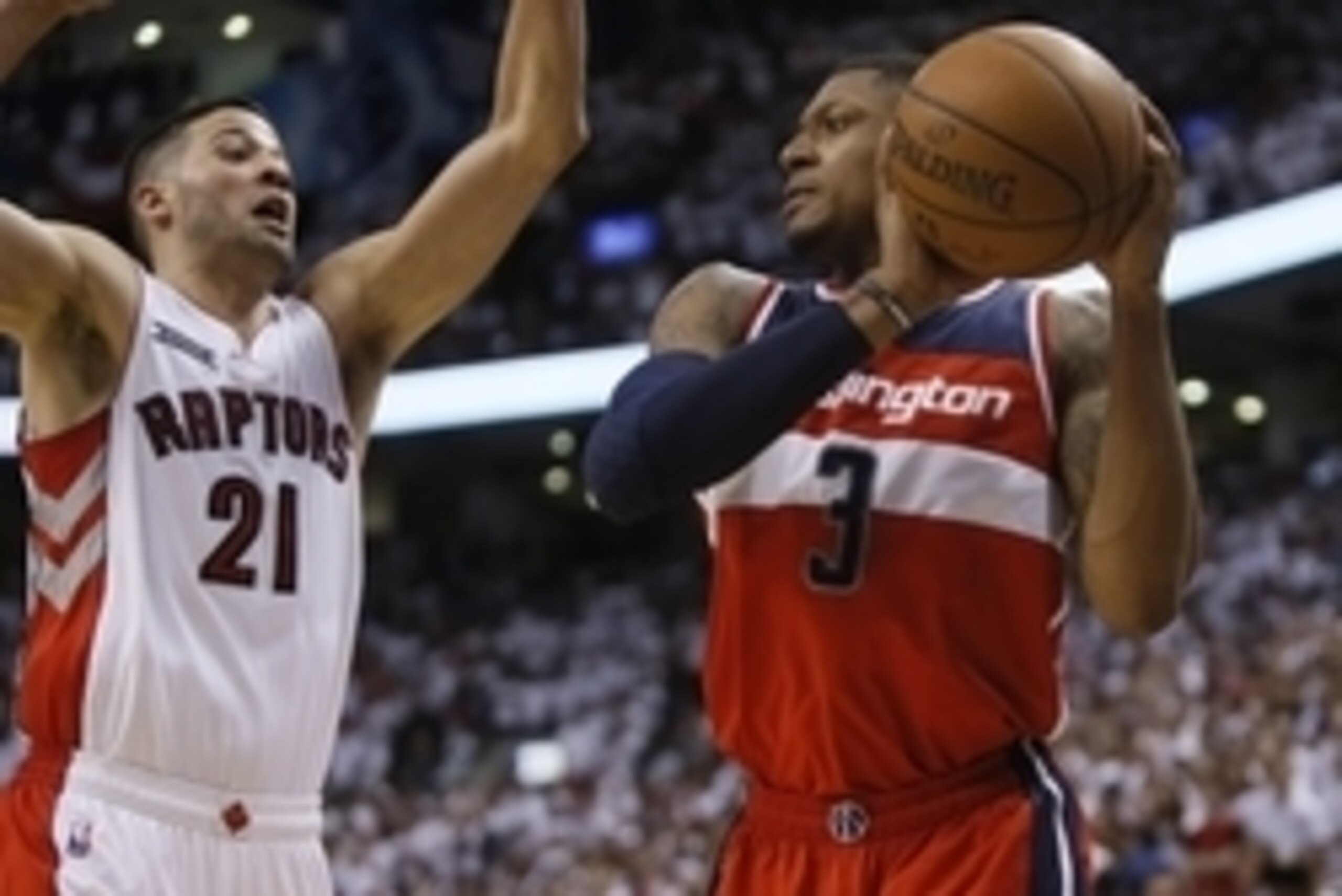 Apr 18, 2015; Toronto, Ontario, CAN; Washington Wizards guard Bradley Beal (3) looks to shoot as Toronto Raptors guard Greivis Vasquez (21) defends in game one of the first round of the NBA Playoffs at Air Canada Centre. Washington defeated Toronto 93-86.