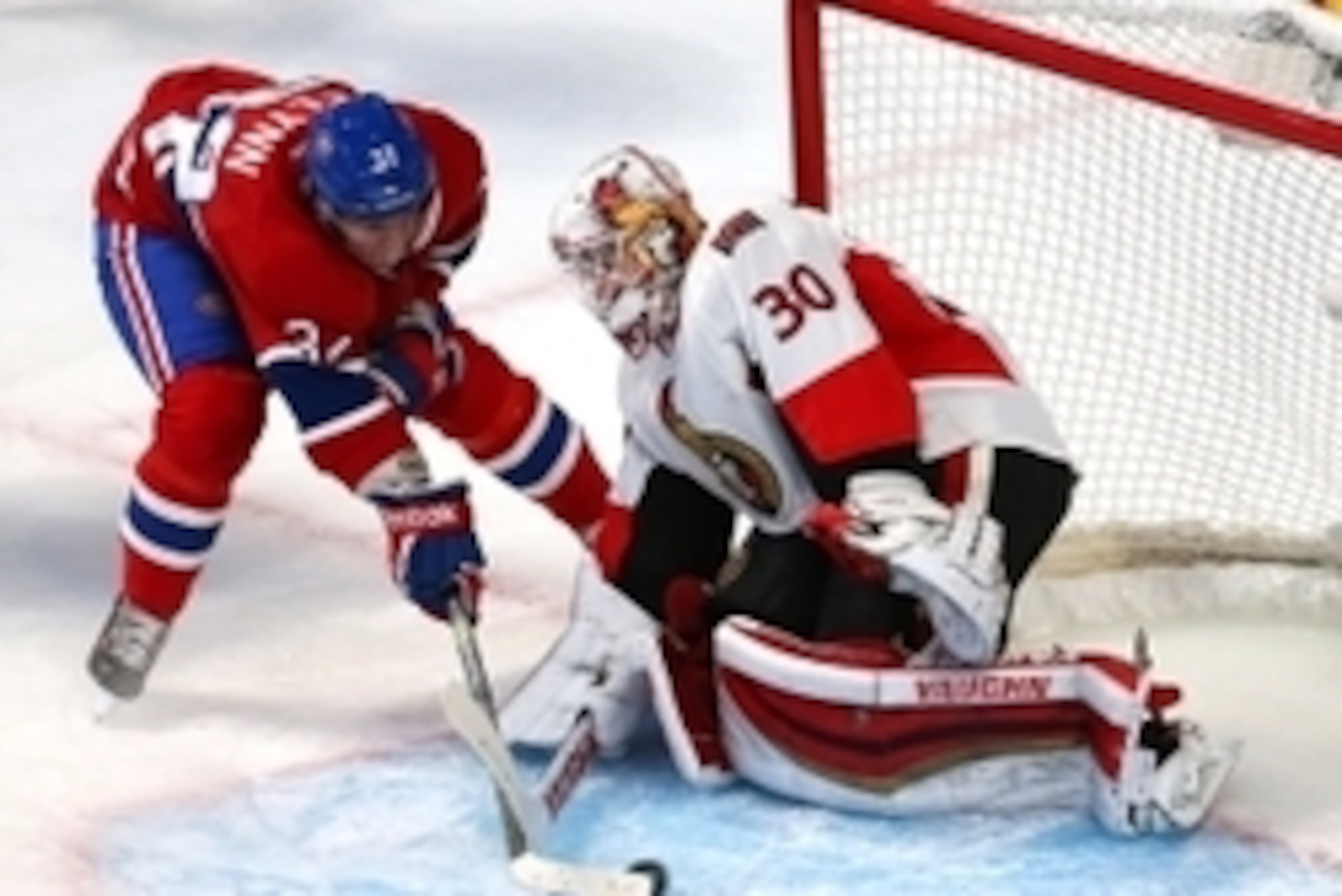 Apr 15, 2015; Montreal, Quebec, CAN; Montreal Canadiens right wing Brian Flynn (32) scores a goal against Ottawa Senators goalie Andrew Hammond (30) during the second period in the game one of the first round of the 2015 Stanley Cup Playoffs at Bell Centr