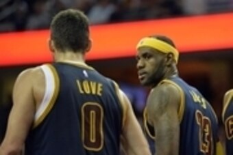 Oct 30, 2014; Cleveland, OH, USA; Cleveland Cavaliers forward LeBron James (23) talks with forward Kevin Love (0) and forward Tristan Thompson (13) against the New York Knicks at Quicken Loans Arena. New York won 95-90. Mandatory Credit: David Richard-USA