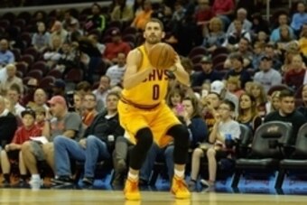 Oct 14, 2014; Cleveland, OH, USA; Cleveland Cavaliers forward Kevin Love (0) shoots against the Milwaukee Bucks at Quicken Loans Arena. Cleveland won 106-100. Mandatory Credit: David Richard-USA TODAY Sports