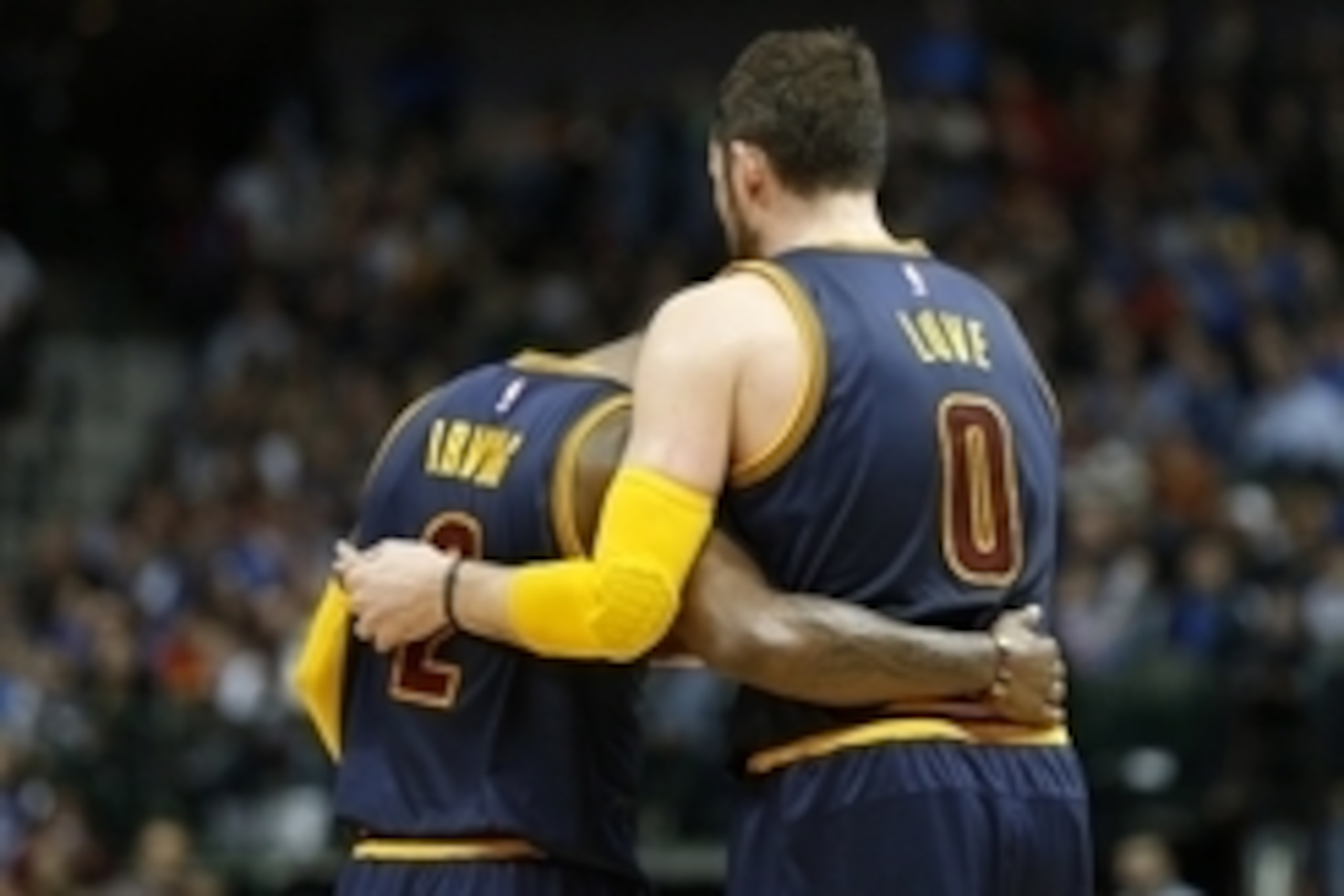 Mar 10, 2015; Dallas, TX, USA; Cleveland Cavaliers guard Kyrie Irving (2) hugs forward Kevin Love (0) during the game against the Dallas Mavericks at American Airlines Center. The Cavs beat the Mavs 127-94. Mandatory Credit: Matthew Emmons-USA TODAY Sport