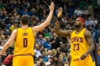 Jan 31, 2015; Minneapolis, MN, USA; Cleveland Cavaliers forward Kevin Love (0) celebrates with forward LeBron James (23) during the fourth quarter against the Minnesota Timberwolves at Target Center. The Cavaliers defeated the Timberwolves 106-90. Mandato