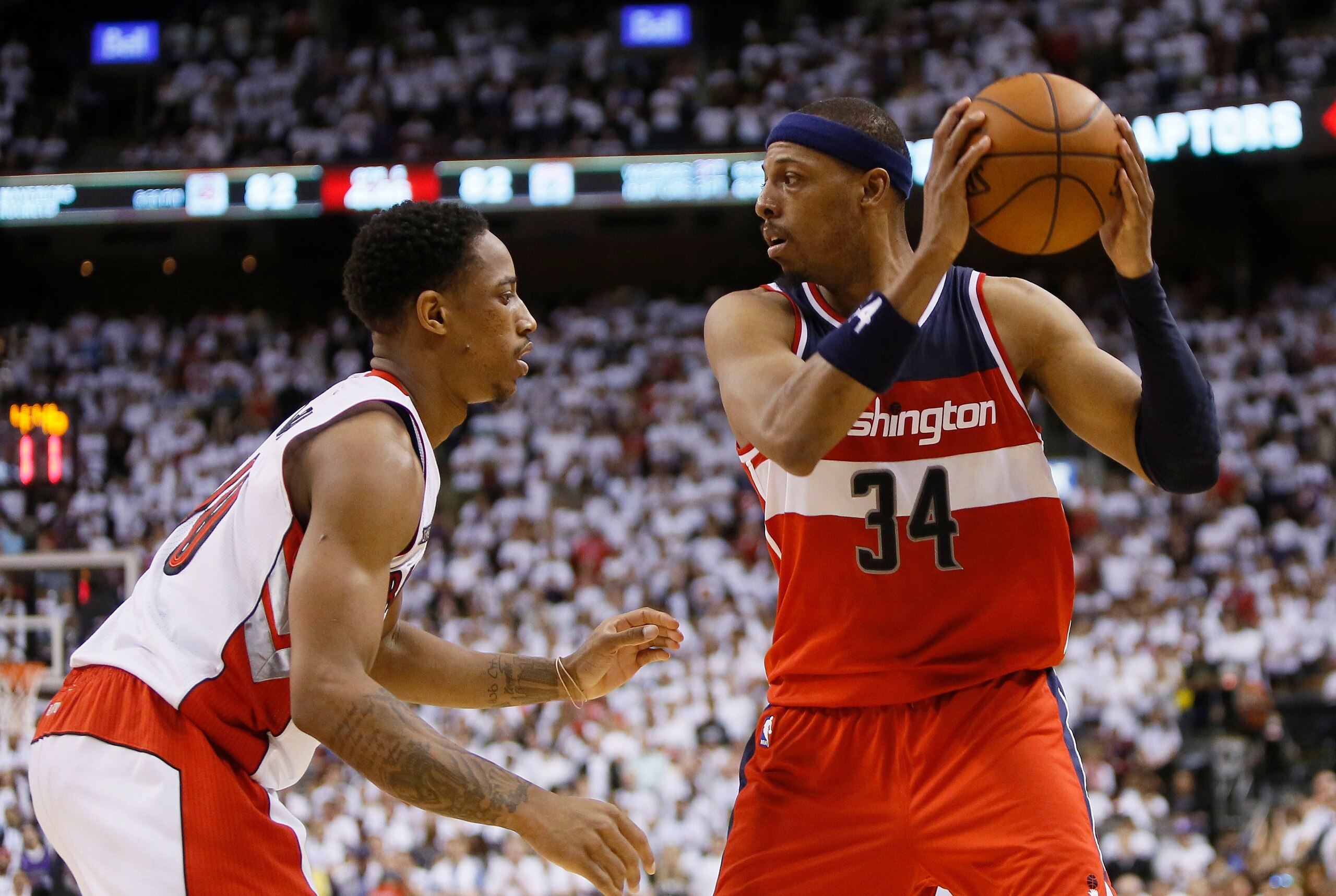 Apr 18, 2015; Toronto, Ontario, CAN; Washington Wizards forward Paul Pierce (34) keeps the ball away from Toronto Raptors guard DeMar DeRozan (10) in game one of the first round of the NBA Playoffs at Air Canada Centre. Washington defeated Toronto 93-86.