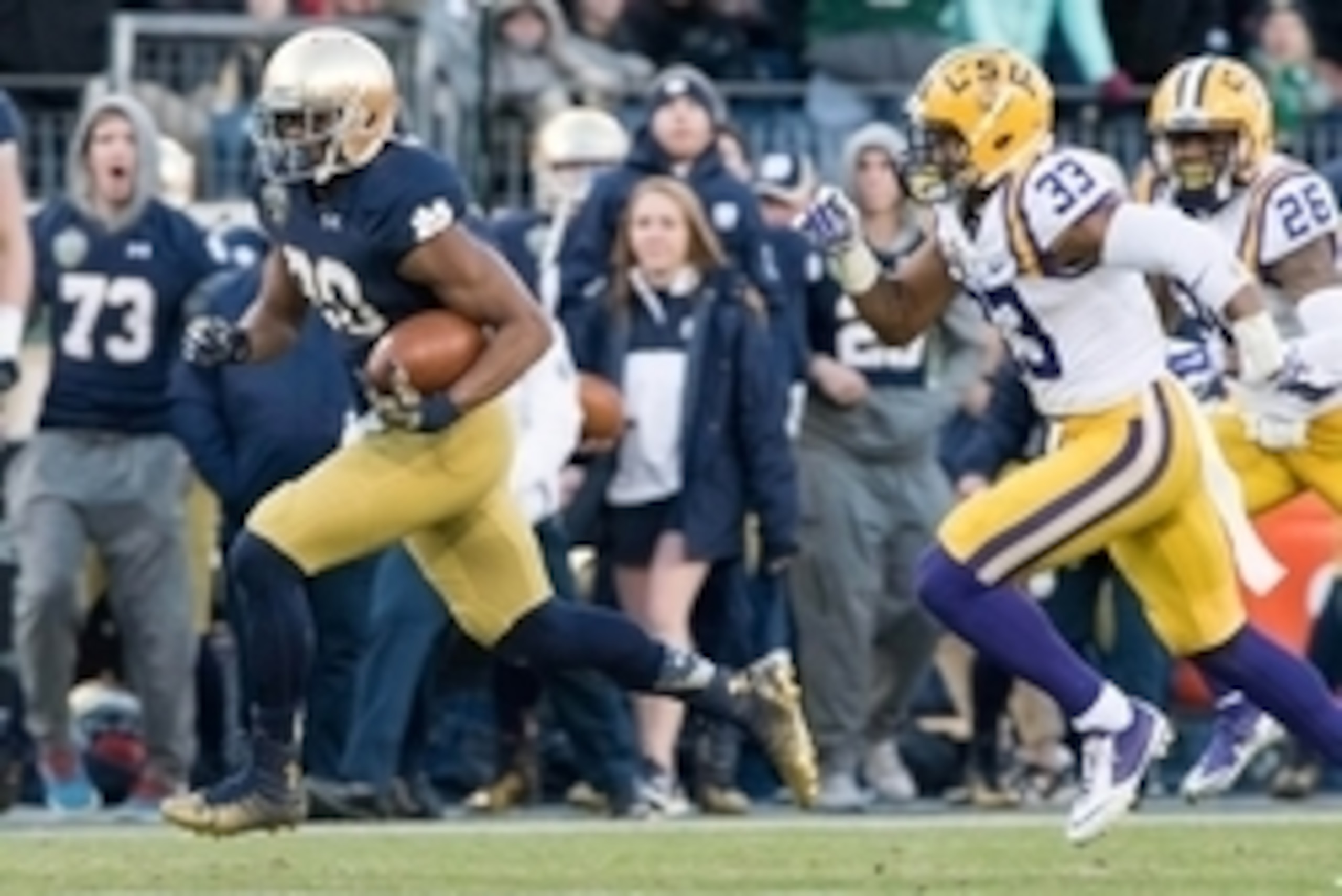 Dec 30, 2014; Nashville, TN, USA; Notre Dame Fighting Irish wide receiver C.J. Prosise (20) runs for a touchdown as Louisiana State Tigers safety Jamal Adams (33) pursues in the third quarter at LP Field. Notre Dame won 31-28. Mandatory Credit: Matt Casho Dec 30, 2014; Nashville, TN, USA; Notre Dame Fighting Irish wide receiver C.J. Prosise (20) runs for a touchdown as Louisiana State Tigers safety Jamal Adams (33) pursues in the third quarter at LP Field. Notre Dame won 31-28. Mandatory Credit: Matt Casho