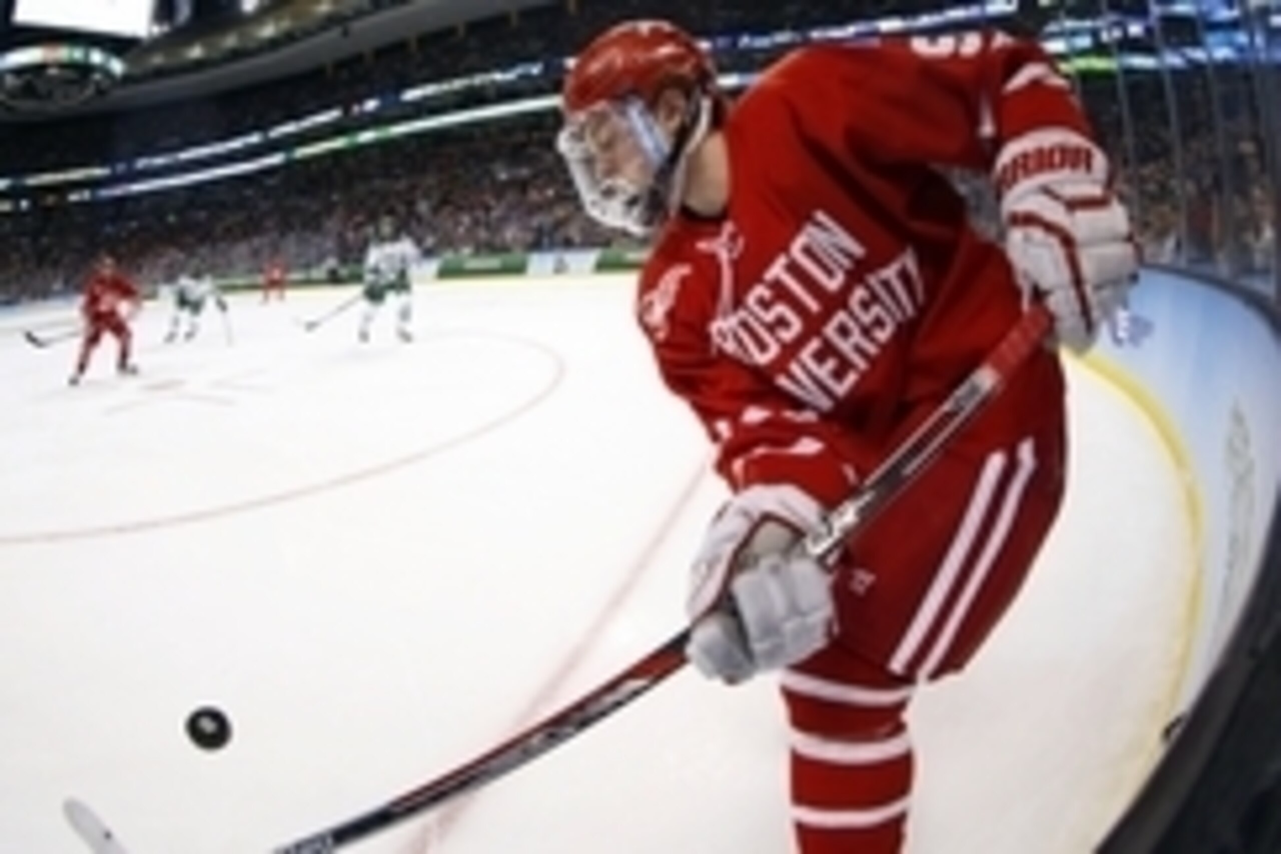 Apr 9, 2015; Boston, MA, USA; Boston University forward Jack Eichel (9) tries to control the puck against North Dakota during the second period of a semifinal game in the men's Frozen Four college ice hockey tournament at TD Garden. Mandatory Credit: Wins Apr 9, 2015; Boston, MA, USA; Boston University forward Jack Eichel (9) tries to control the puck against North Dakota during the second period of a semifinal game in the men's Frozen Four college ice hockey tournament at TD Garden. Mandatory Credit: Wins