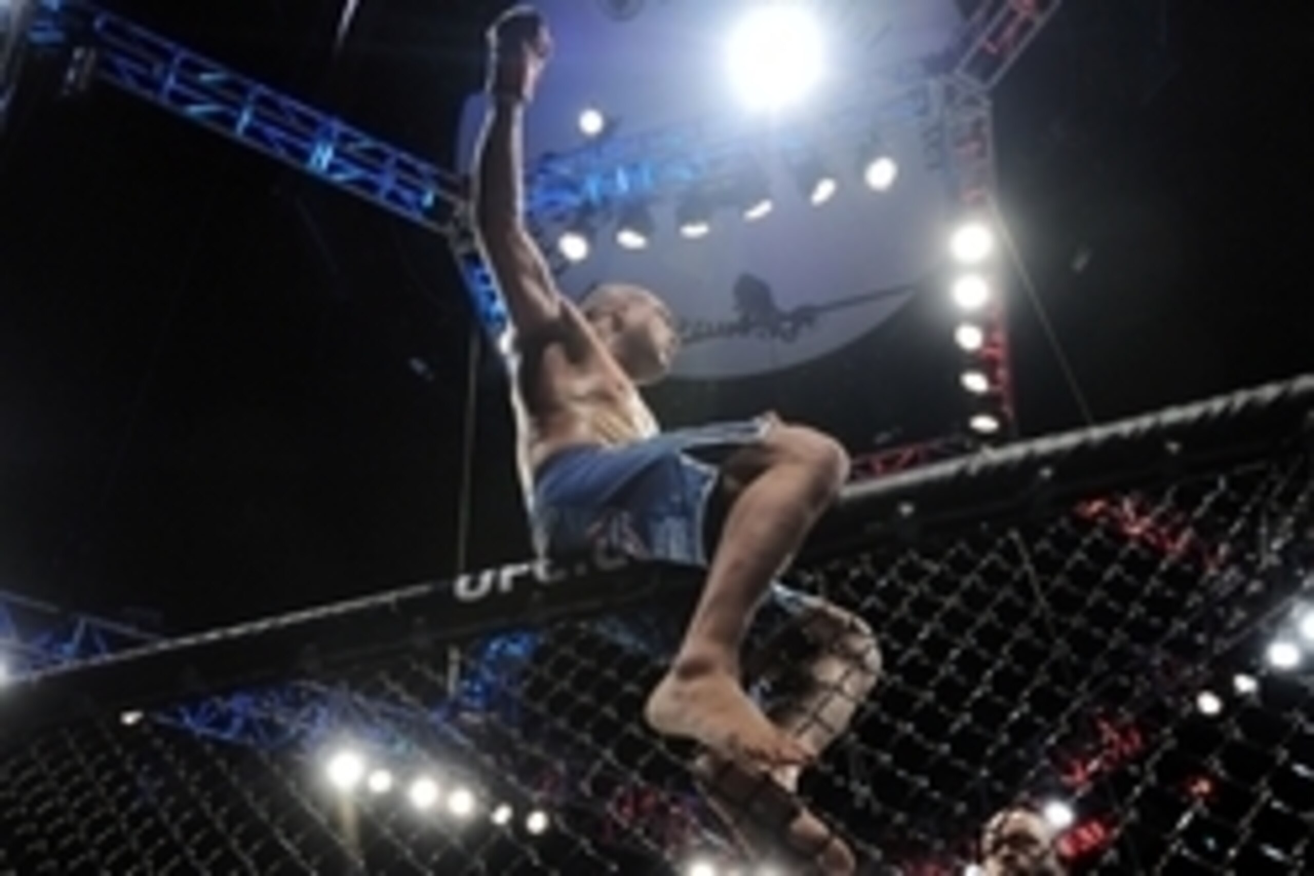 Apr 18, 2015; Newark, NJ, USA; Diego Brandao (red gloves) celebrates after defeating Jimmy Hettes (not pictured) during UFC Fight Night at Prudential Center. Brandao won after the fight was stopped after the first round due to a cut on the ear of Hettes. 