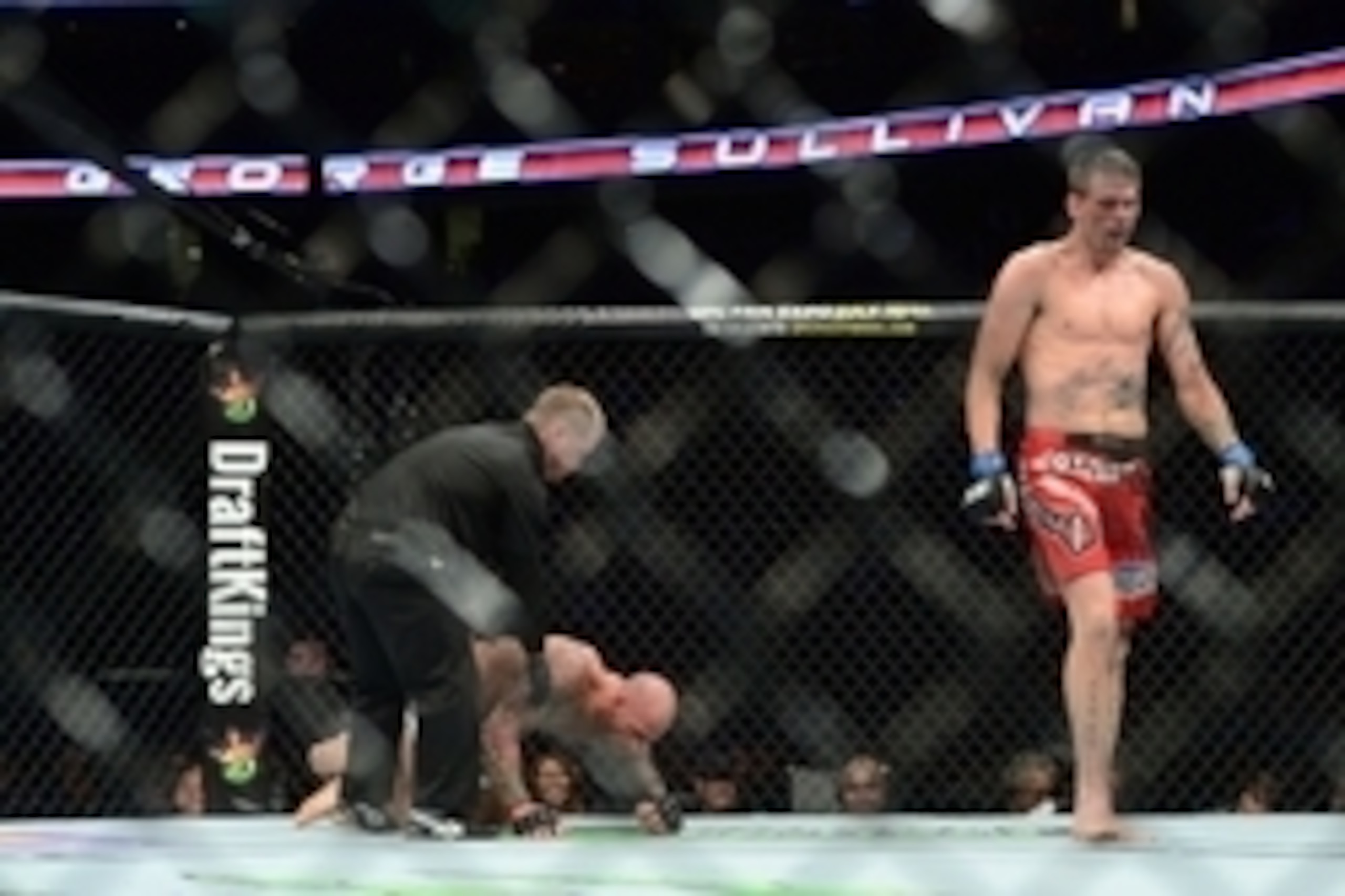 Apr 18, 2015; Newark, NJ, USA; George Sullivan (red gloves) reacts after tapping out to Tim Means (blue gloves) during UFC Fight Night at Prudential Center. Means won via third round tap out. Mandatory Credit: Joe Camporeale-USA TODAY Sports