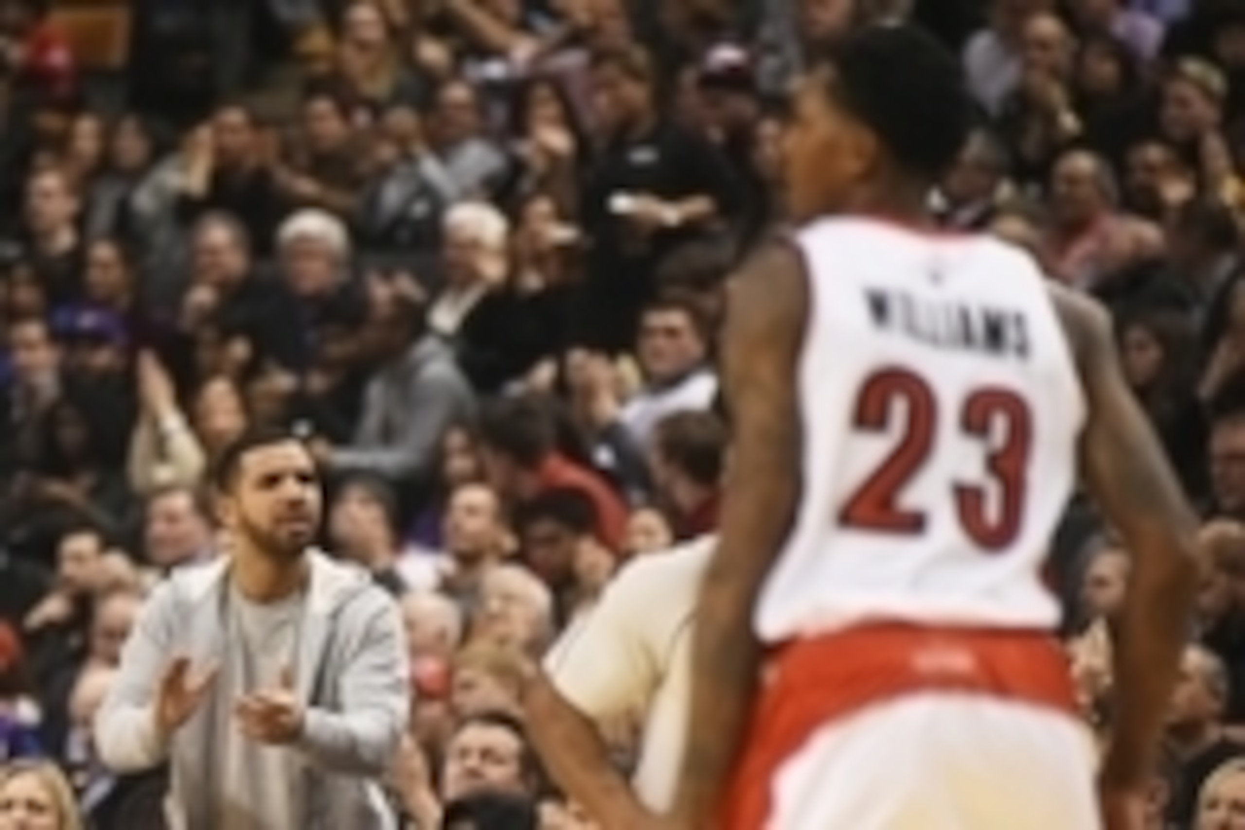 Dec 15, 2014; Toronto, Ontario, CAN; Singer and Toronto Raptors fan Drake applauds Raptors guard Lou Williams after he sank a three-point shot during the Raptors 95-82 win over Orlando Magic at Air Canada Centre. Mandatory Credit: Dan Hamilton-USA TODAY S Dec 15, 2014; Toronto, Ontario, CAN; Singer and Toronto Raptors fan Drake applauds Raptors guard Lou Williams after he sank a three-point shot during the Raptors 95-82 win over Orlando Magic at Air Canada Centre. Mandatory Credit: Dan Hamilton-USA TODAY S