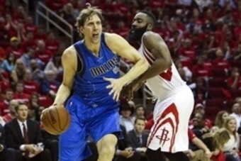 Apr 18, 2015; Houston, TX, USA; Dallas Mavericks forward Dirk Nowitzki (41) drives the ball during the third quarter as Houston Rockets guard James Harden (13) defends in game one of the first round of the NBA Playoffs at Toyota Center. Mandatory Credit: 
