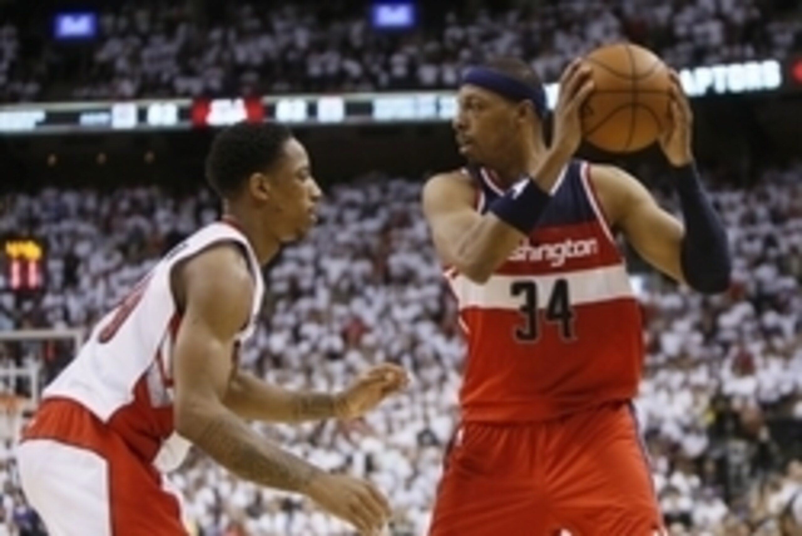 Apr 18, 2015; Toronto, Ontario, CAN; Washington Wizards forward Paul Pierce (34) keeps the ball away from Toronto Raptors guard DeMar DeRozan (10) in game one of the first round of the NBA Playoffs at Air Canada Centre. Washington defeated Toronto 93-86. 
