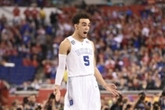 Apr 6, 2015; Indianapolis, IN, USA; Duke Blue Devils guard Tyus Jones (5) reacts after hitting a three-point shot against the Wisconsin Badgers during the second half in the 2015 NCAA Men's Division I Championship game at Lucas Oil Stadium. Mandatory Cred