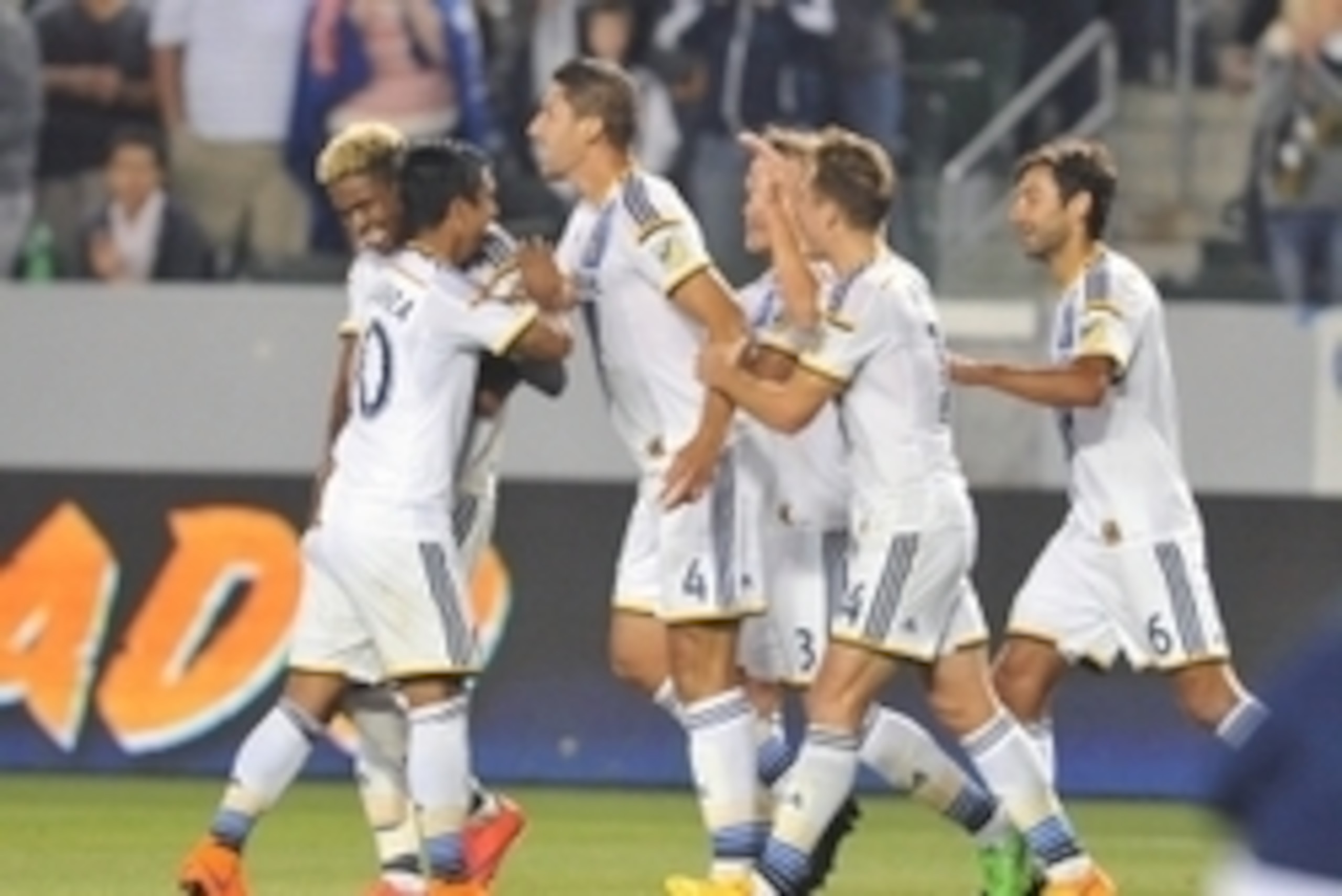 April 18, 2015; Carson, CA, USA; Los Angeles Galaxy defender Omar Gonzalez (4) celebrates his goal scored with teammates against Sporting KC during the second half at StubHub Center. Mandatory Credit: Gary A. Vasquez-USA TODAY Sports