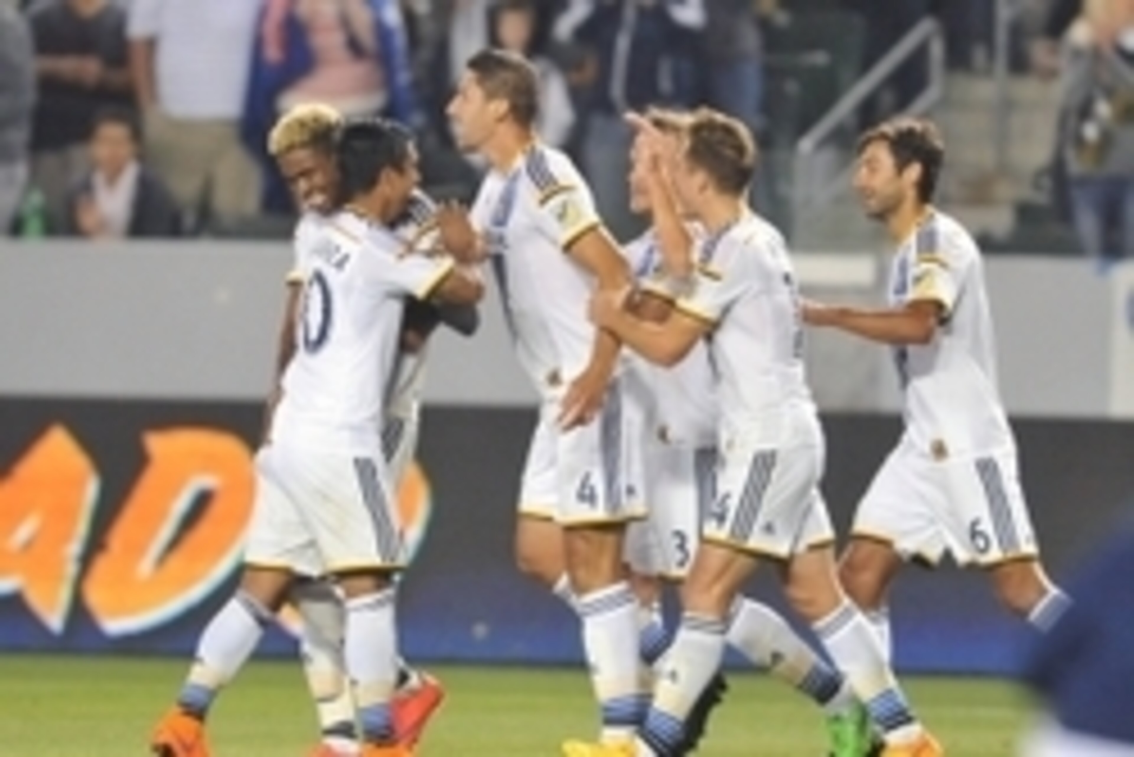 April 18, 2015; Carson, CA, USA; Los Angeles Galaxy defender Omar Gonzalez (4) celebrates his goal scored with teammates against Sporting KC during the second half at StubHub Center. Mandatory Credit: Gary A. Vasquez-USA TODAY Sports