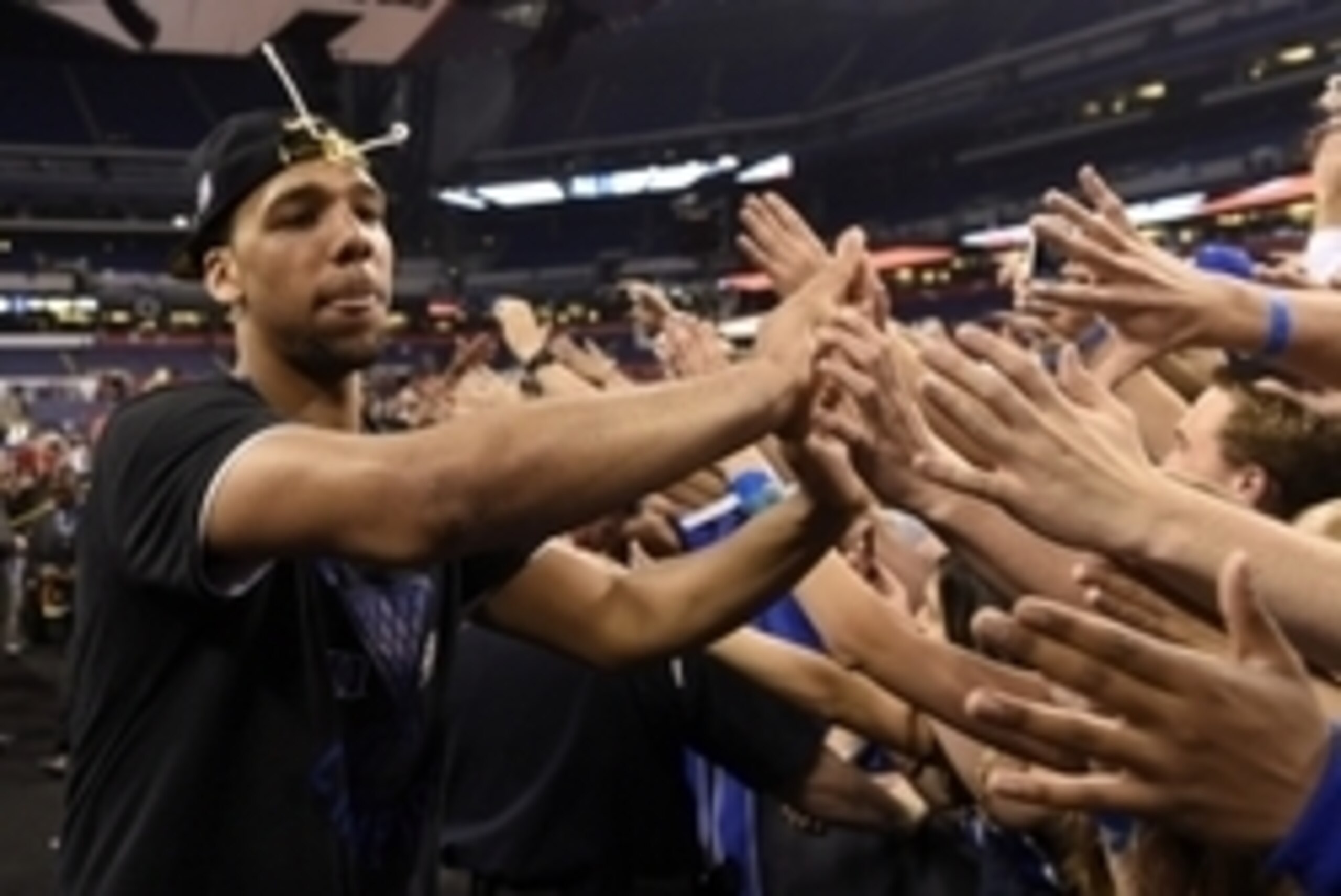 Apr 6, 2015; Indianapolis, IN, USA; Duke Blue Devils center Jahlil Okafor celebrates with fans after defeating the Wisconsin Badgers the 2015 NCAA Men's Division I Championship game at Lucas Oil Stadium. Mandatory Credit: Bob Donnan-USA TODAY Sports Apr 6, 2015; Indianapolis, IN, USA; Duke Blue Devils center Jahlil Okafor celebrates with fans after defeating the Wisconsin Badgers the 2015 NCAA Men's Division I Championship game at Lucas Oil Stadium. Mandatory Credit: Bob Donnan-USA TODAY Sports