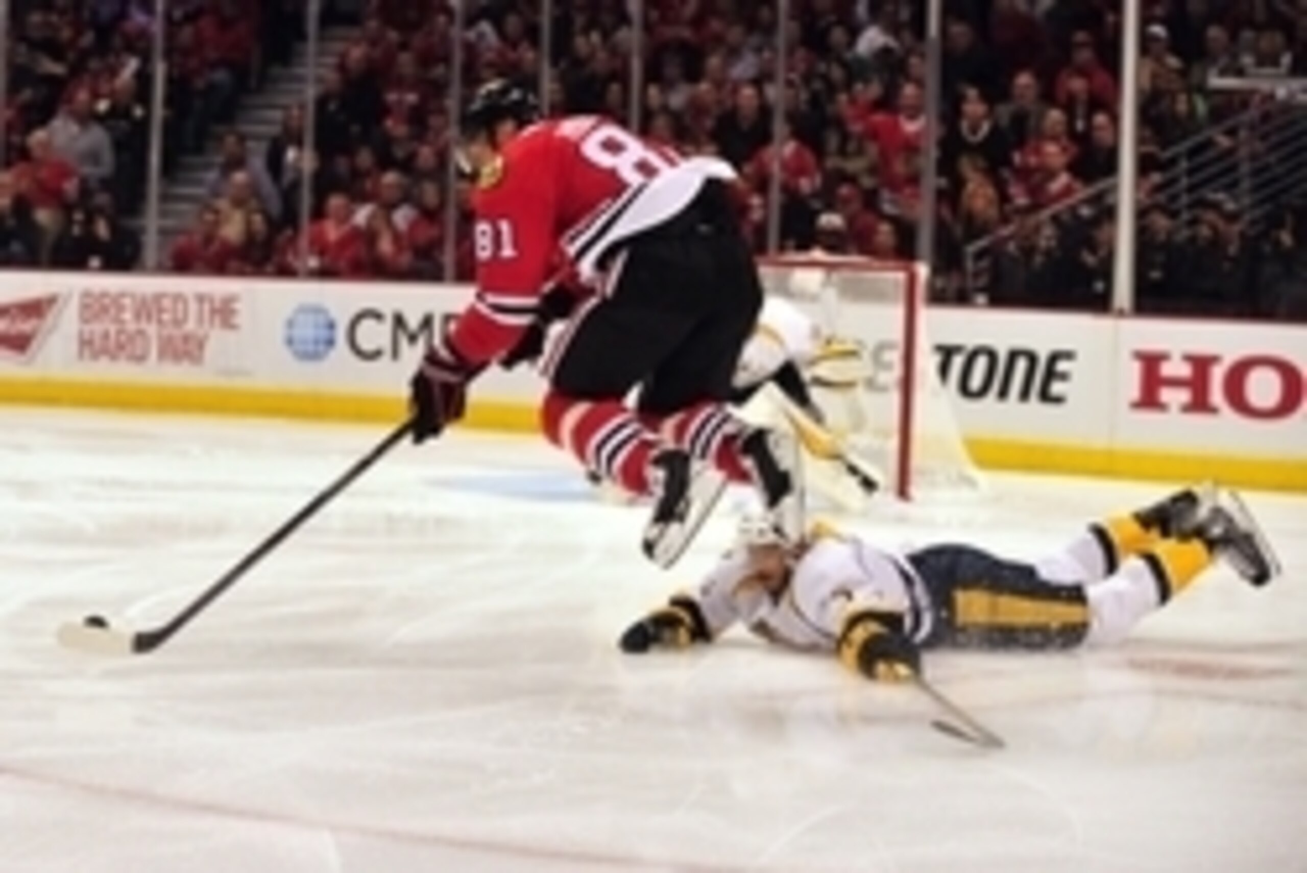 Apr 19, 2015; Chicago, IL, USA; Chicago Blackhawks right wing Marian Hossa (81) leaps over Nashville Predators defenseman Seth Jones (3) during the first period in game three of the first round of the 2015 Stanley Cup Playoffs at the United Center. Mandat