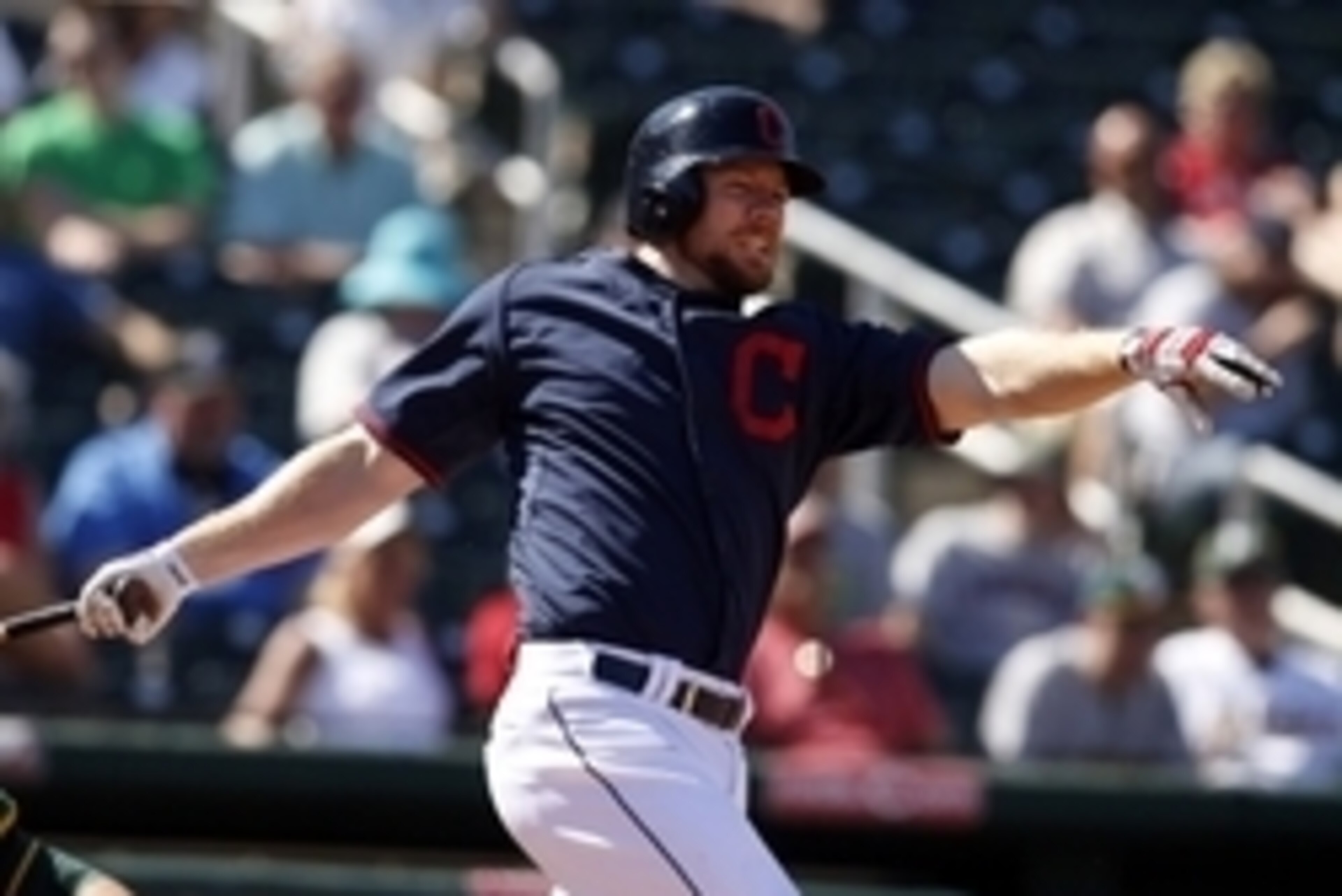 Mar 23, 2015; Goodyear, AZ, USA; Cleveland Indians first baseman Brandon Moss (44) reacts after hitting in the fifth against the Oakland Athletics during a spring training game at Goodyear Ballpark. Mandatory Credit: Rick Scuteri-USA TODAY Sports