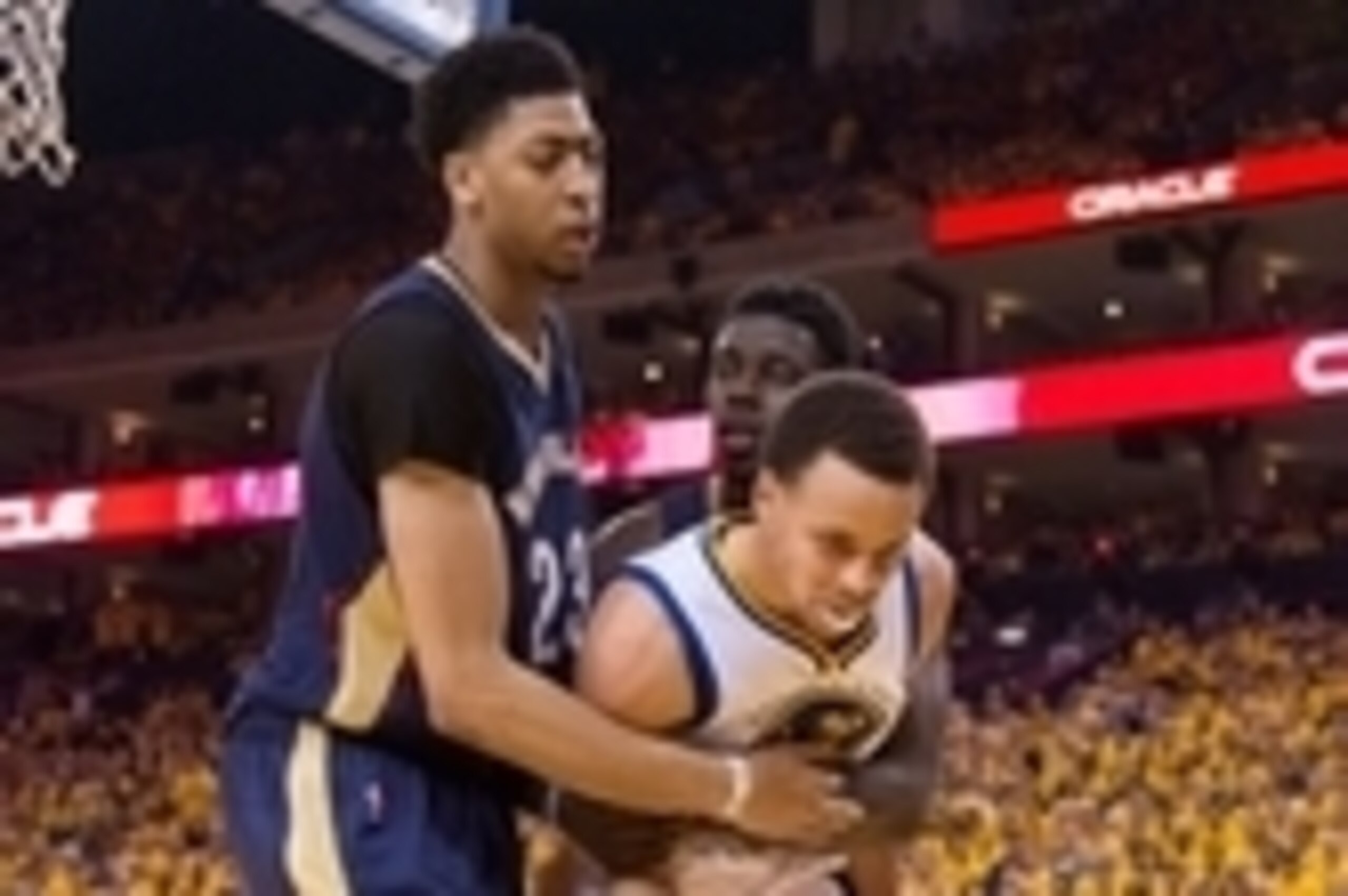 April 18, 2015; Oakland, CA, USA; New Orleans Pelicans guard Jrue Holiday (11, right) fouls Golden State Warriors guard Stephen Curry (30) in front of Pelicans forward Anthony Davis (23, left) during the fourth quarter in game one of the first round of th