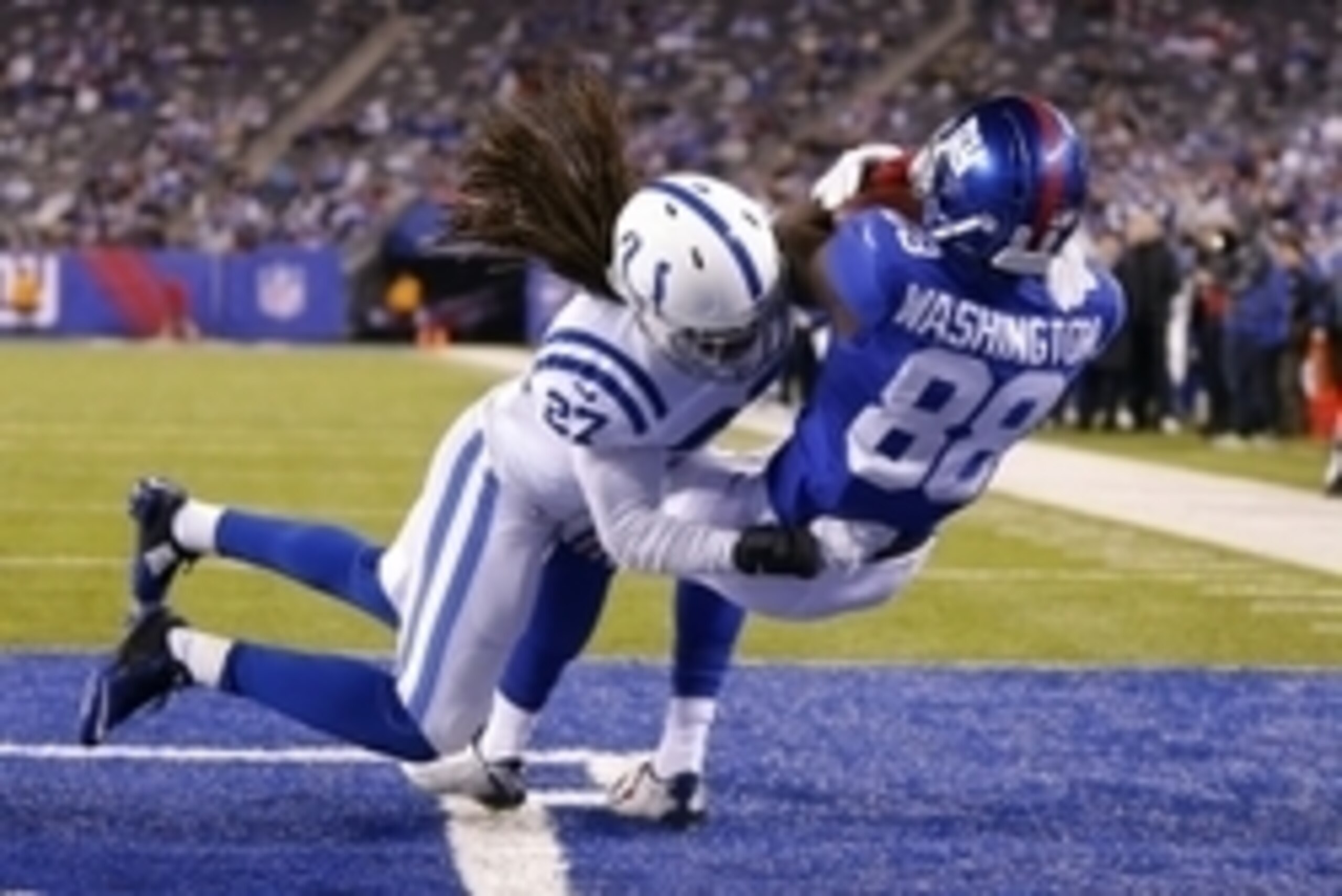 Nov 3, 2014; East Rutherford, NJ, USA;  New York Giants wide receiver Corey Washington (88) makes touchdown reception during the second half against Indianapolis Colts free safety Josh Gordy (27) at MetLife Stadium. Indianapolis Colts defeat the New York 