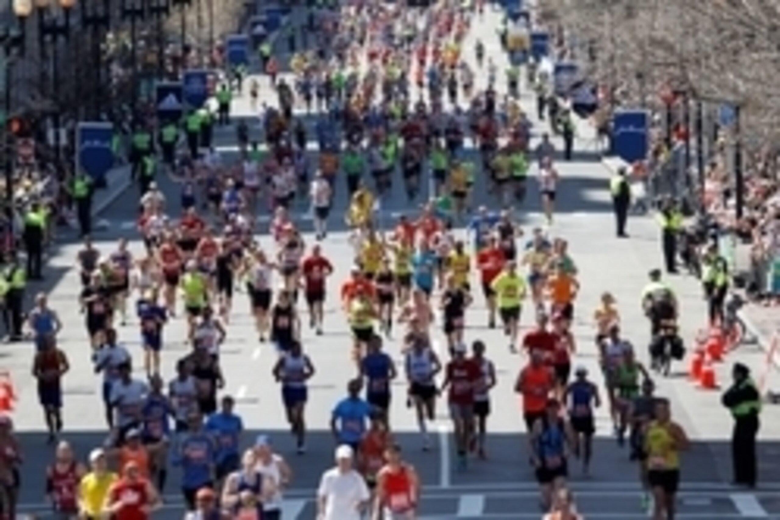 Apr 21, 2014; Boston, MA, USA; Runners stream down Boylston Street towards the finish line during the 2014 Boston Marathon. Mandatory Credit: Greg M. Cooper-USA TODAY Sports