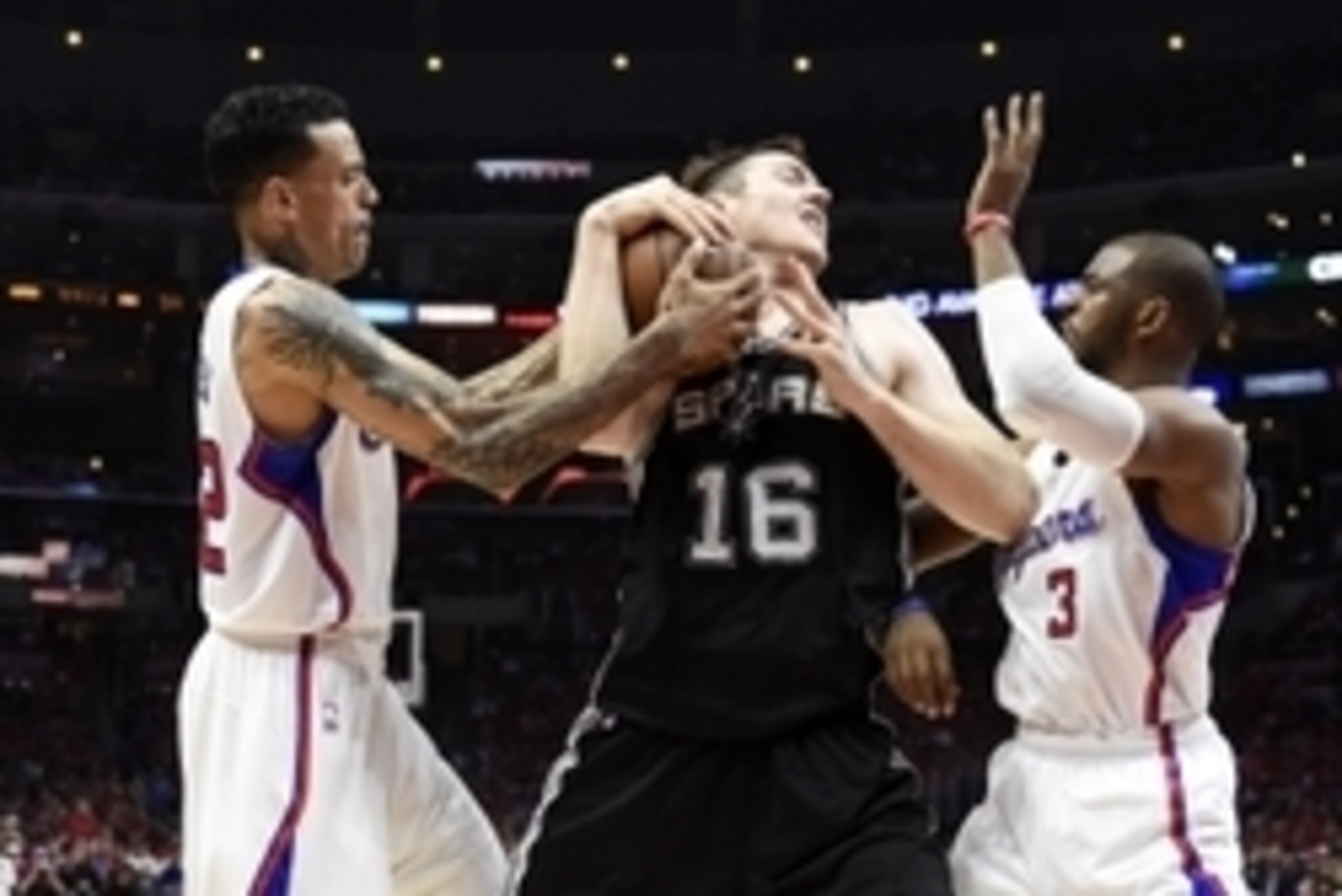Apr 19, 2015; Los Angeles, CA, USA; San Antonio Spurs center Aron Baynes (16) fights for a loose ball with Los Angeles Clippers guard Chris Paul (3) and forward Matt Barnes (22) during the third quarter in game one of the first round of the NBA Playoffs a