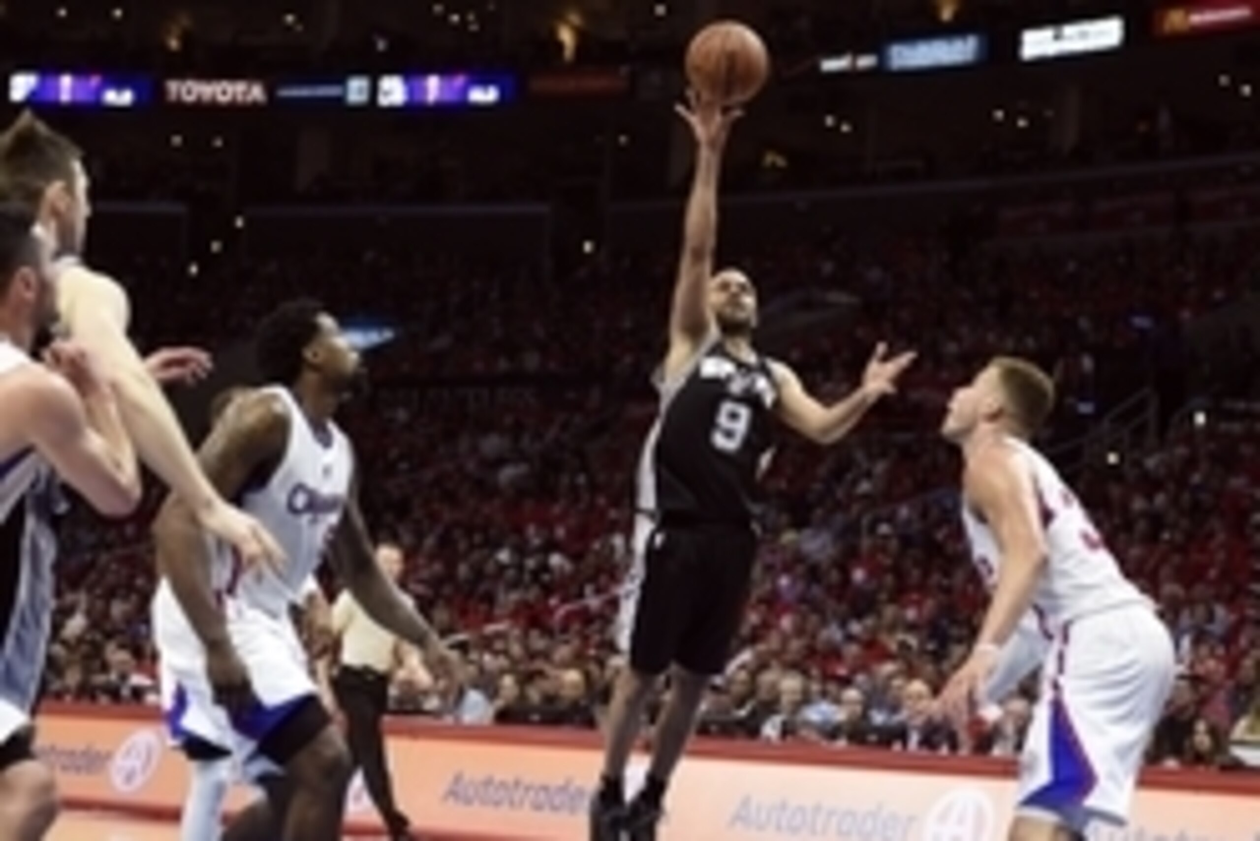 Apr 19, 2015; Los Angeles, CA, USA; San Antonio Spurs guard Tony Parker (9) shoots the ball against Los Angeles Clippers forward Blake Griffin (32) and center DeAndre Jordan (6) during the third quarter in game one of the first round of the NBA Playoffs a