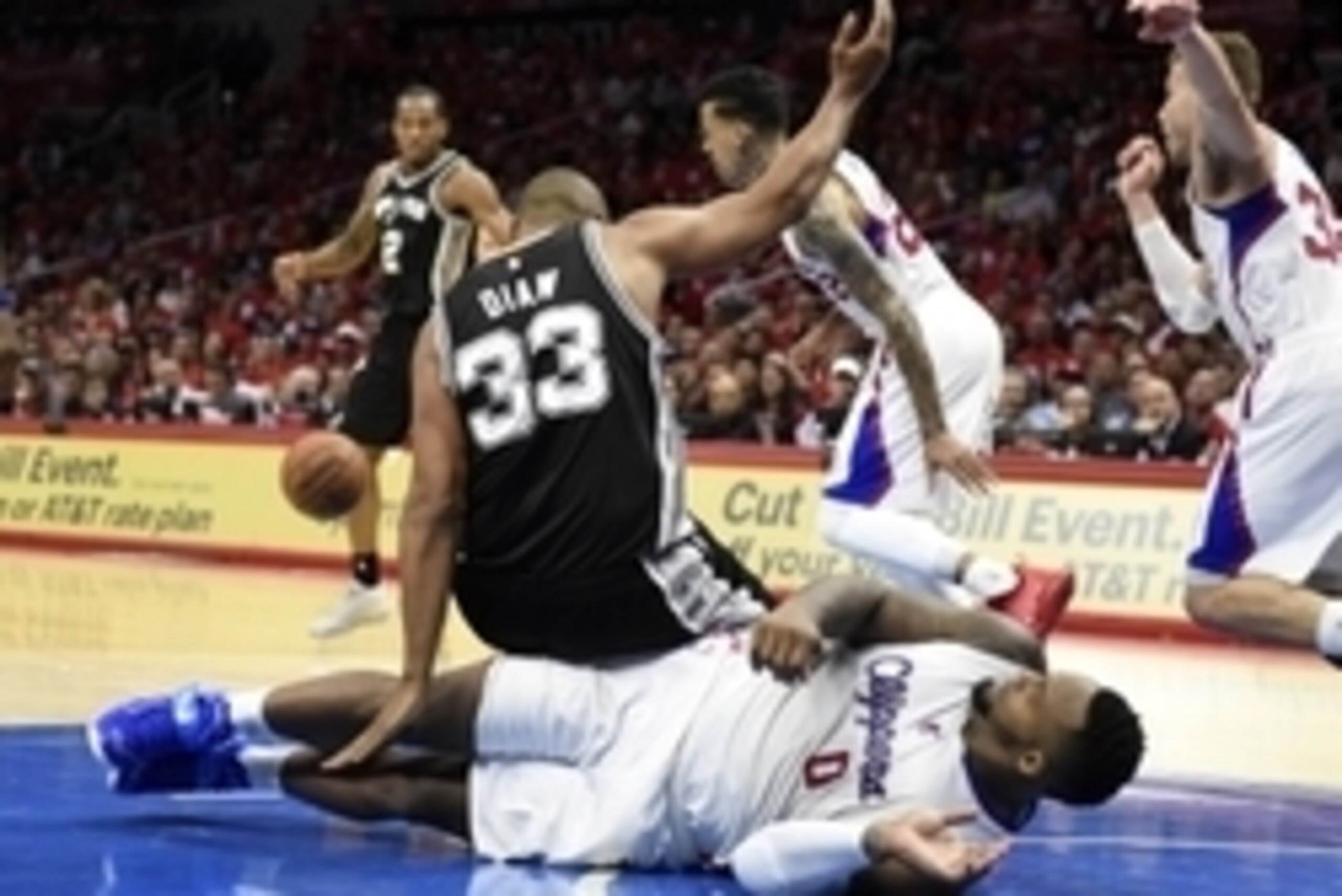 Apr 19, 2015; Los Angeles, CA, USA; San Antonio Spurs center Boris Diaw (33) falls on Los Angeles Clippers forward Glen Davis (0) during the third quarter in game one of the first round of the NBA Playoffs at Staples Center. Mandatory Credit: Richard Mack