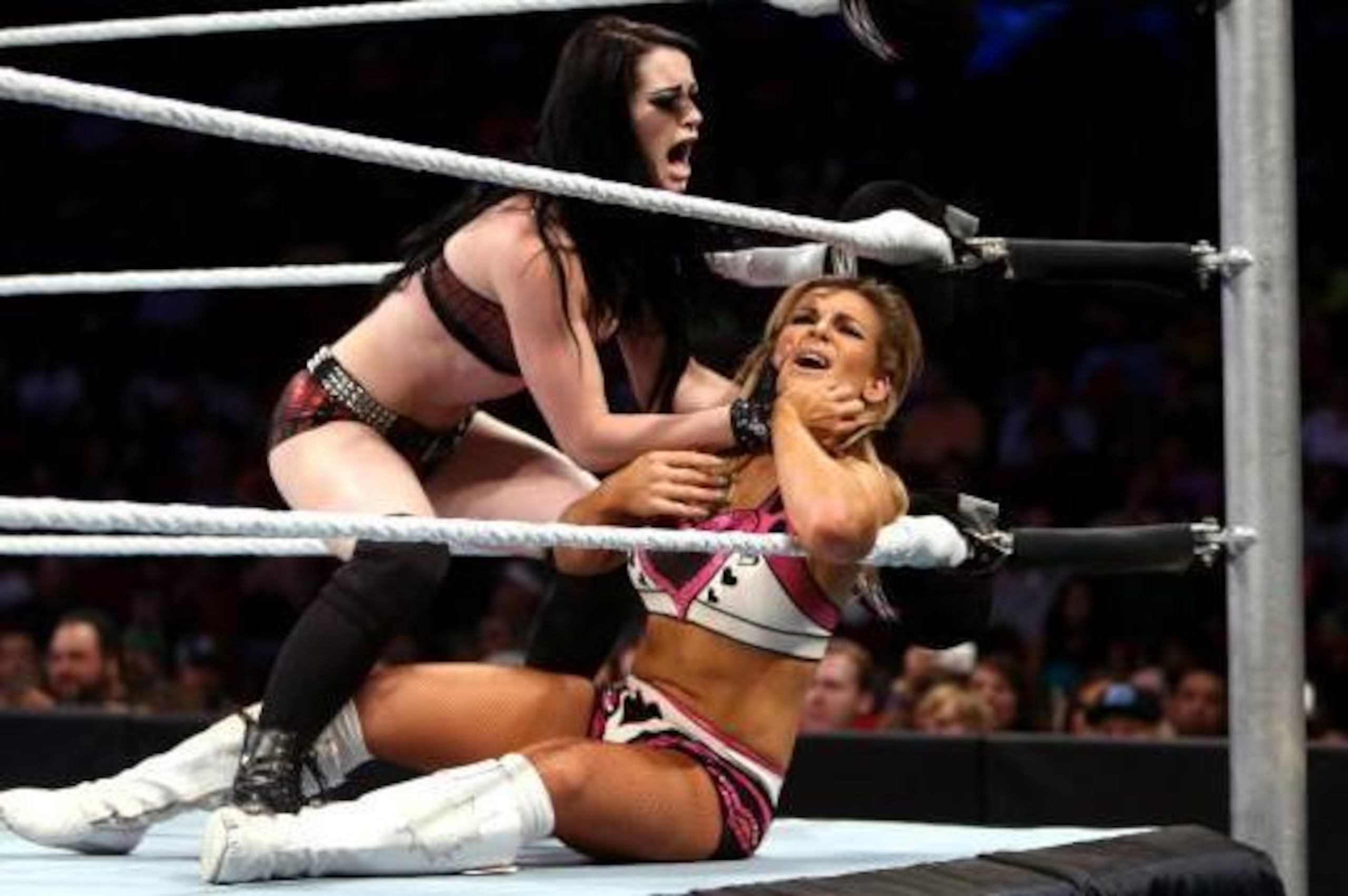 Paige attacks Natalya. Paige attacks Natalya.