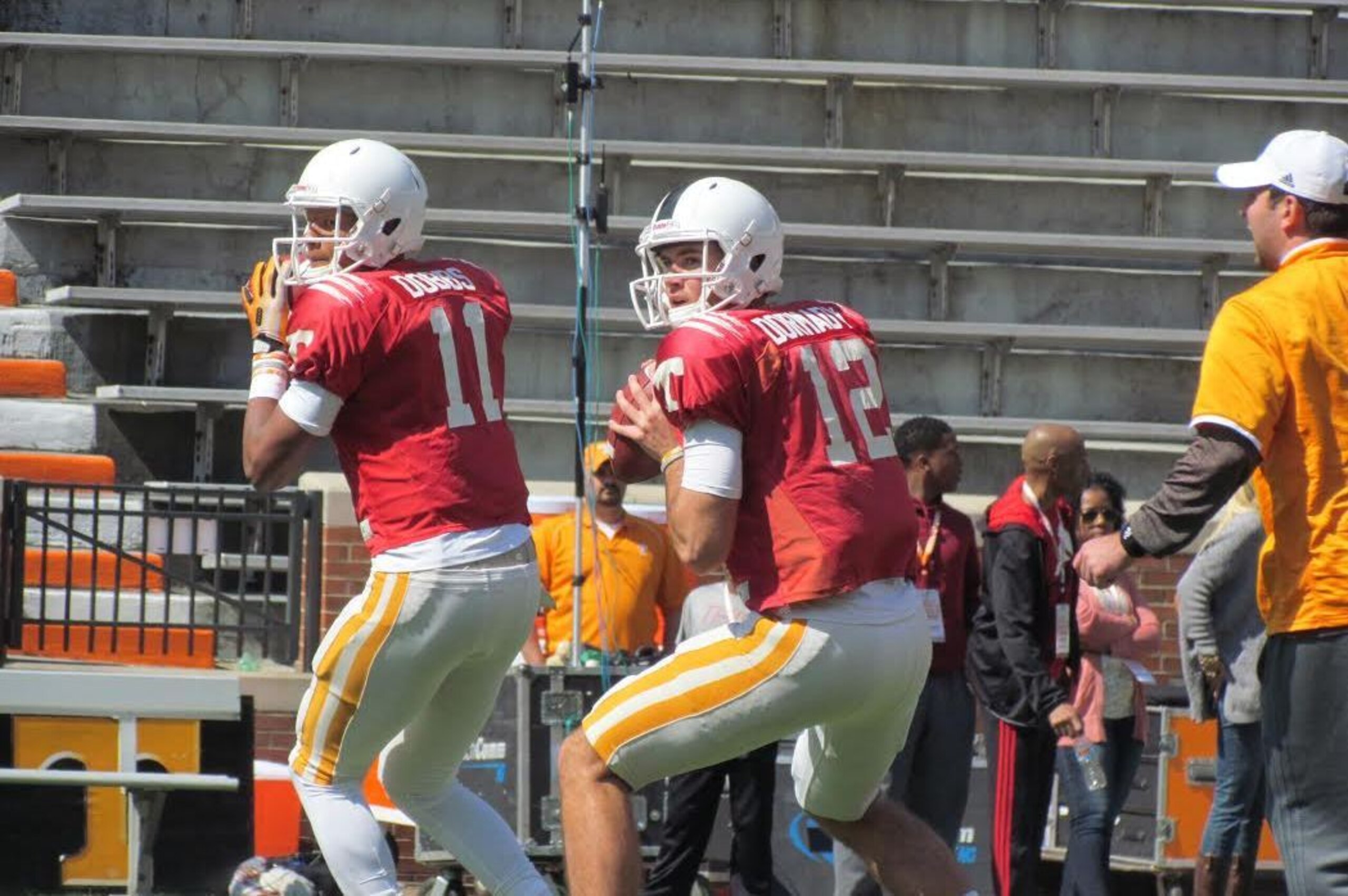 Dobbs (left) is providing leadership to the young midterm quarterbacks, including Quinten Dormady (right).