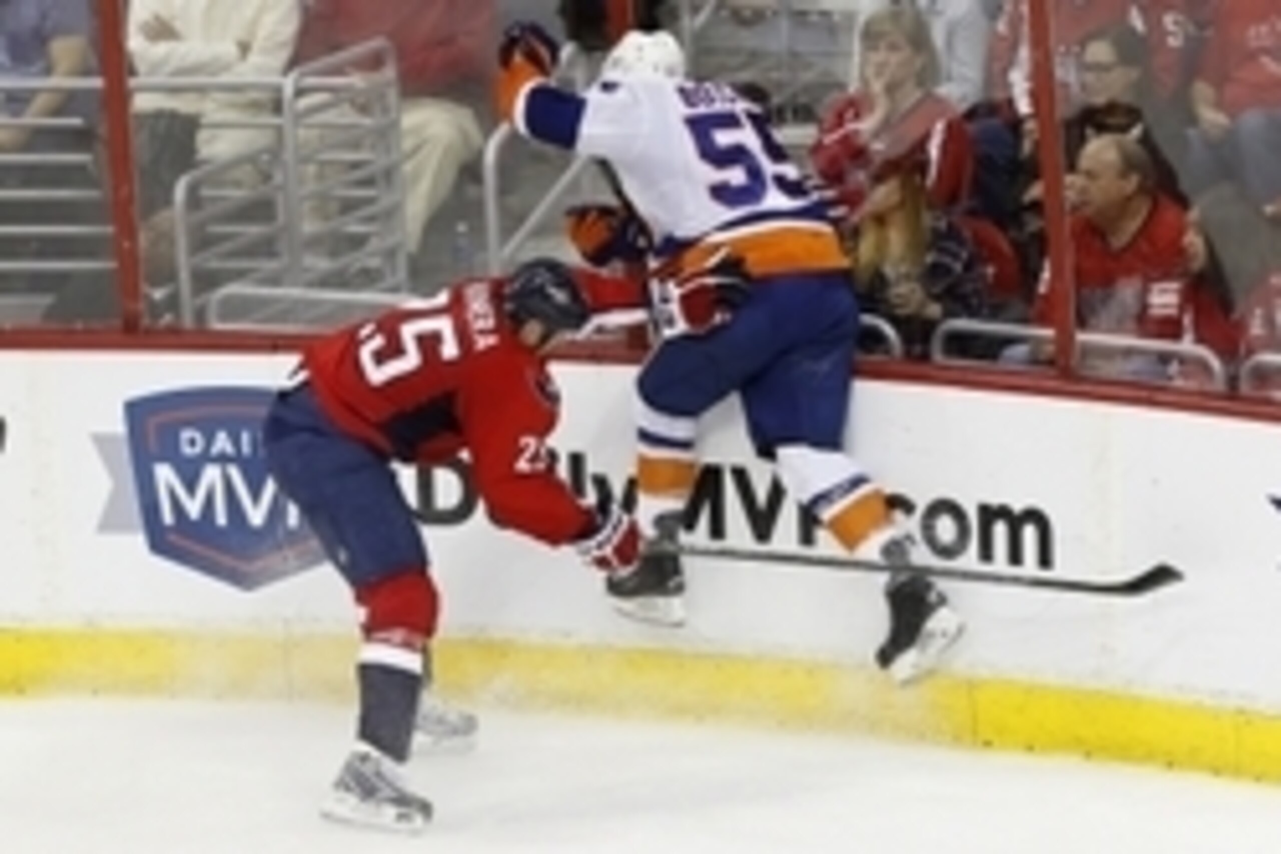 Apr 17, 2015; Washington, DC, USA; Washington Capitals left wing Jason Chimera (25) checks New York Islanders defenseman Johnny Boychuk (55) in the third period in game two of the first round of the the 2015 Stanley Cup Playoffs at Verizon Center. The Cap