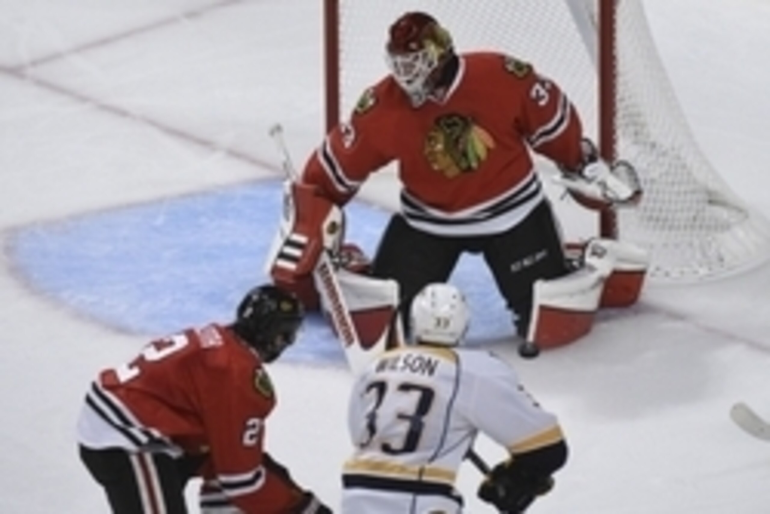 Apr 19, 2015; Chicago, IL, USA;  Chicago Blackhawks goalie Scott Darling (33) makes a save on Nashville Predators center Colin Wilson (33) during the third period in game three of the first round of the 2015 Stanley Cup Playoffs at the United Center. The 