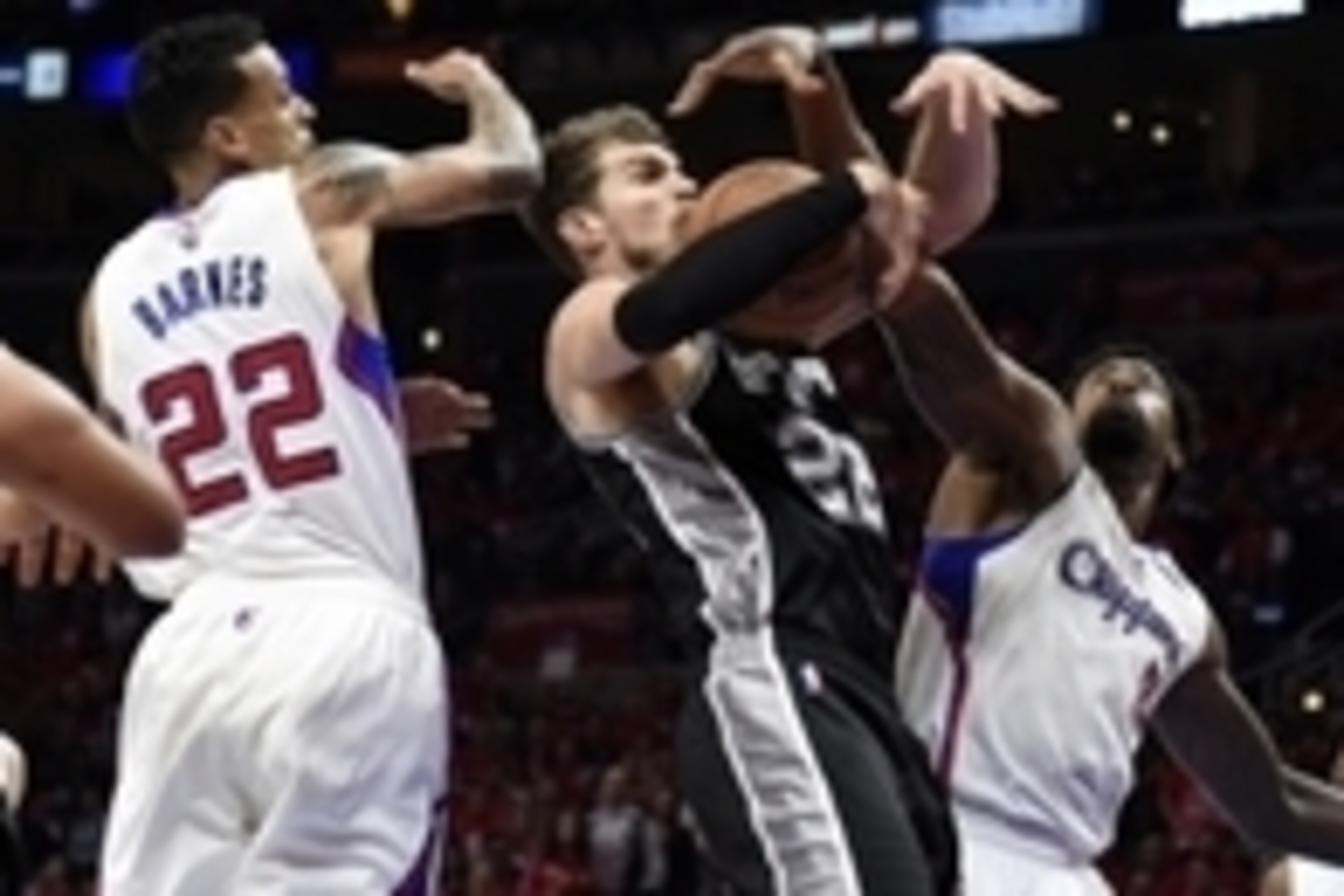 Apr 19, 2015; Los Angeles, CA, USA; San Antonio Spurs center Tiago Splitter (22) grabs a rebound against Los Angeles Clippers center DeAndre Jordan (6) and forward Matt Barnes (22) in game one of the first round of the NBA Playoffs at Staples Center. Mand