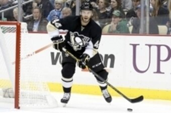 Sep 22, 2014; Pittsburgh, PA, USA; Pittsburgh Penguins defenseman Taylor Chorney (44) skates with the puck against the Detroit Red Wings during the second period at the CONSOL Energy Center. The Red Wings won 2-1. Mandatory Credit: Charles LeClaire-USA TO