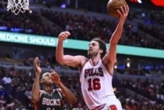 Apr 20, 2015; Chicago, IL, USA; Chicago Bulls forward Pau Gasol (16) shoots the ball against Milwaukee Bucks center John Henson (31) during the second half in game two of the first round of the 2015 NBA Playoffs at the United Center. The Chicago Bulls def