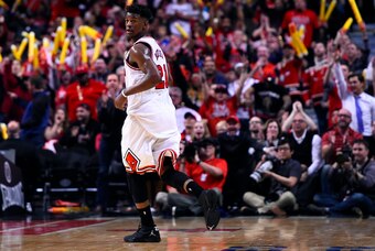 Apr 20, 2015; Chicago, IL, USA; Chicago Bulls guard Jimmy Butler (21) reacts after making a three point basket against the Milwaukee Bucks during the second half in game two of the first round of the 2015 NBA Playoffs at the United Center. The Chicago Bul