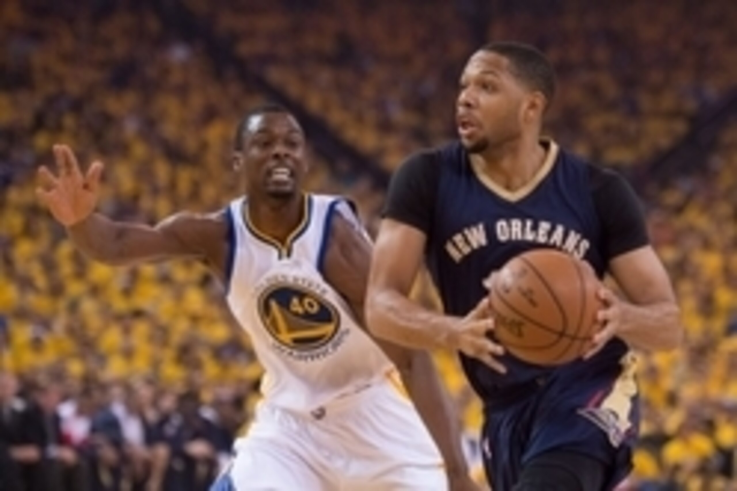 April 20, 2015; Oakland, CA, USA; New Orleans Pelicans guard Eric Gordon (10, right) dribbles the basketball against Golden State Warriors forward Harrison Barnes (40) during the first quarter in game two of the first round of the NBA Playoffs at Oracle A