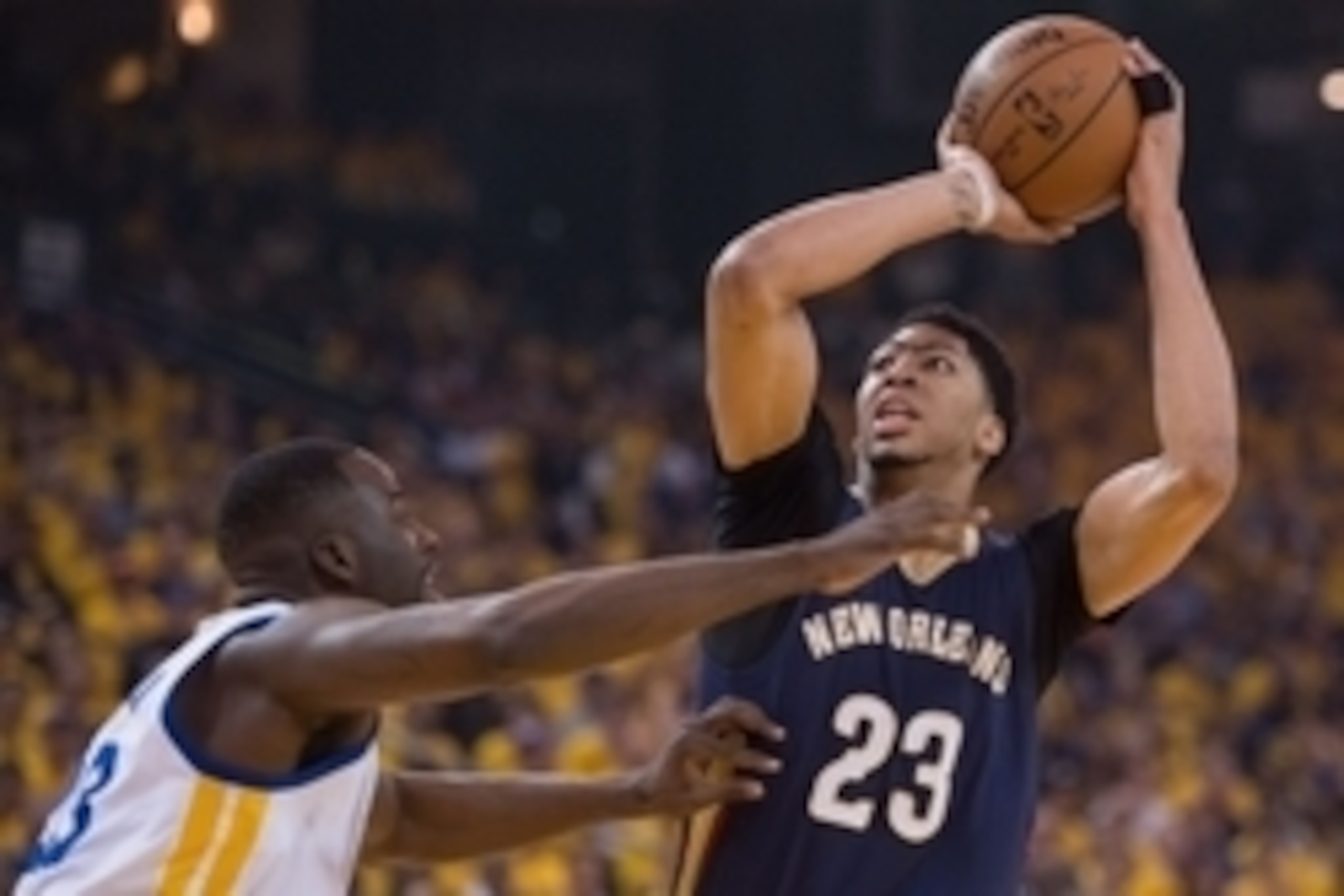 April 20, 2015; Oakland, CA, USA; New Orleans Pelicans forward Anthony Davis (23, right) shoots the basketball against Golden State Warriors forward Draymond Green (23, left) during the first quarter in game two of the first round of the NBA Playoffs at O