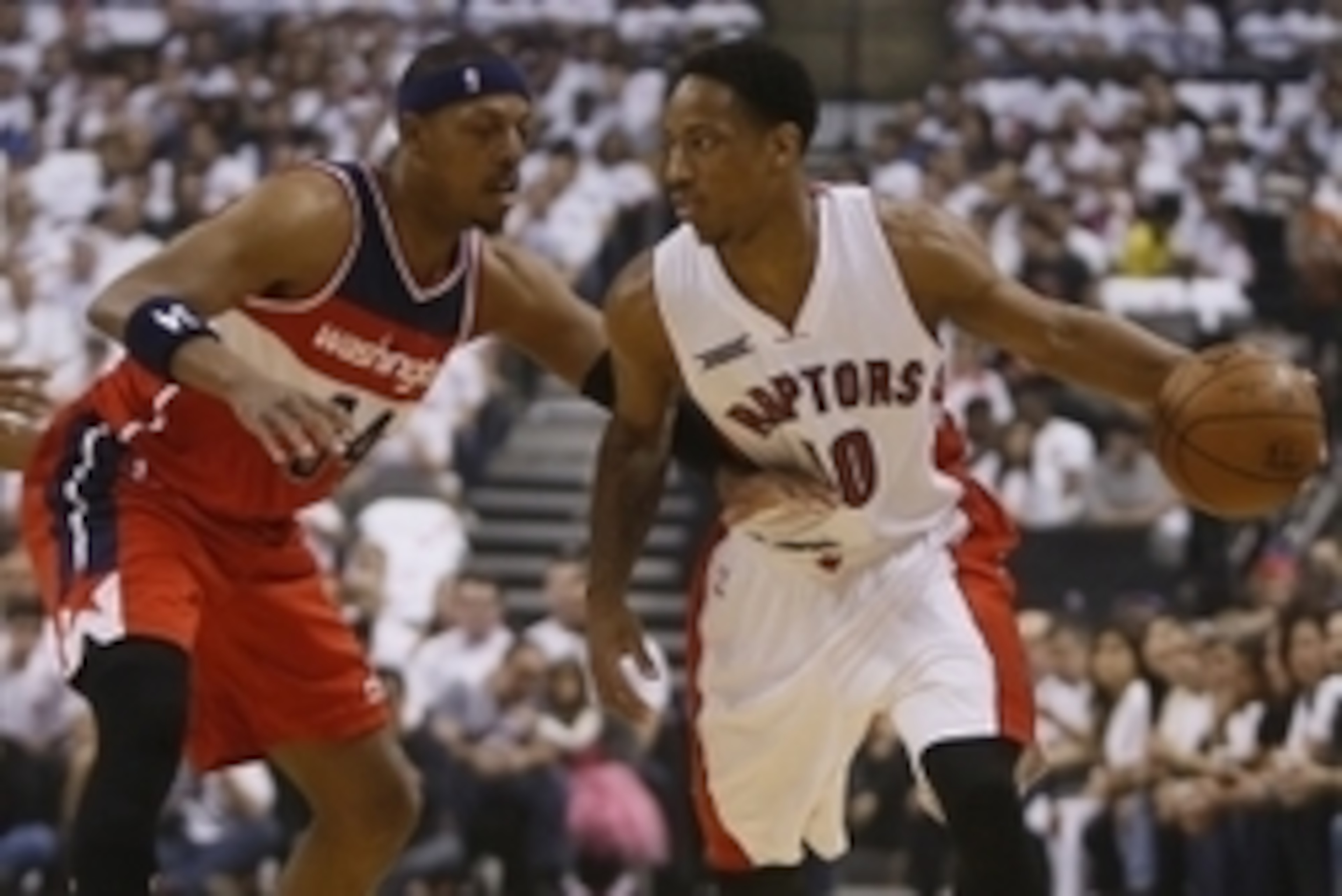Apr 18, 2015; Toronto, Ontario, CAN; Toronto Raptors guard DeMar DeRozan (10) controls the ball against Washington Wizards forward Paul Pierce (34) during the first half in game one of the first round of the NBA Playoffs at Air Canada Centre. Mandatory Cr