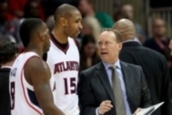 Mar 27, 2015; Atlanta, GA, USA; Atlanta Hawks head coach Mike Budenholzer talks with center Al Horford (15) during a time out in the fourth quarter of their game against the Miami Heat at Philips Arena. The Hawks won 99-86. Mandatory Credit: Jason Getz-US