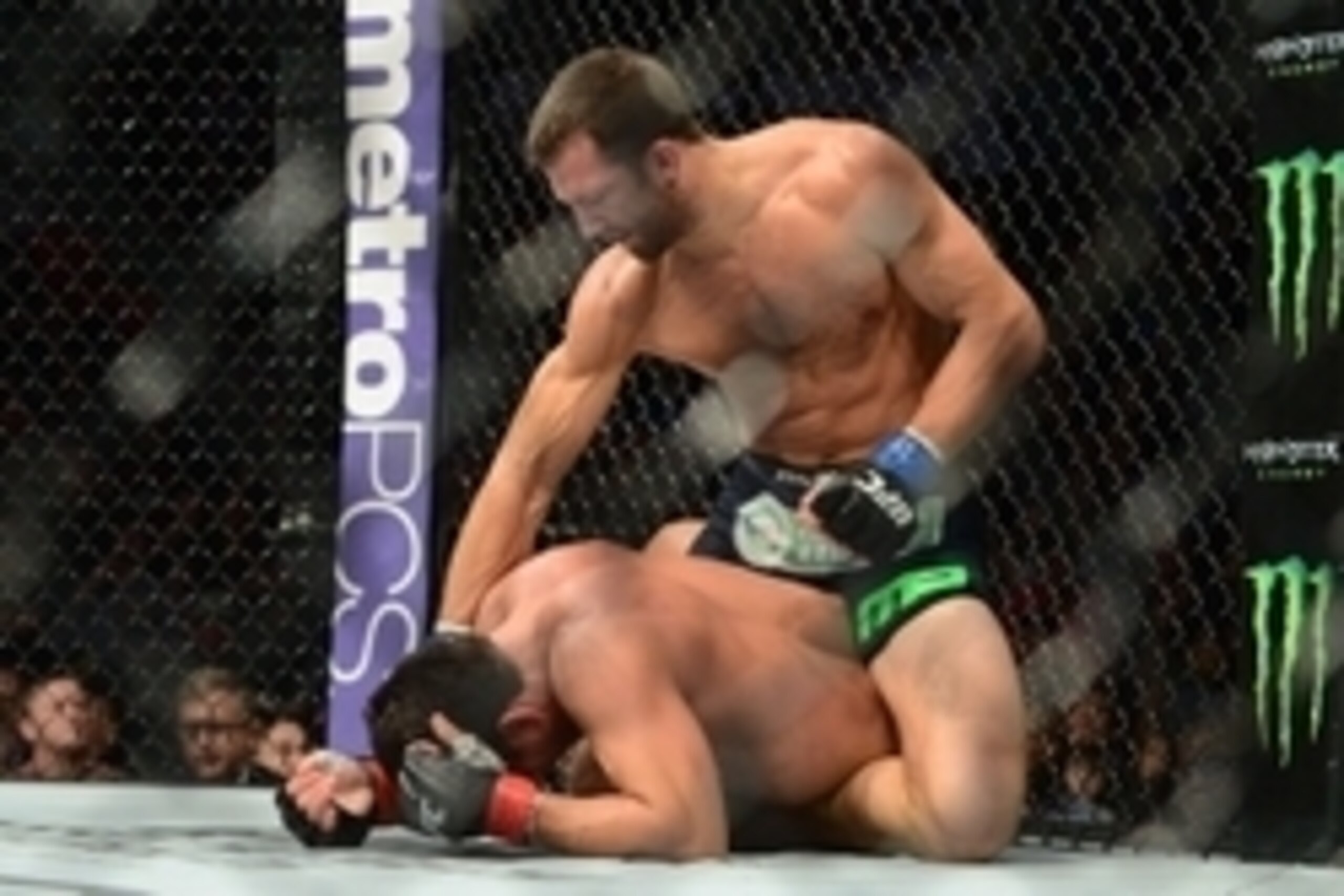 Apr 18, 2015; Newark, NJ, USA; Lyoto Machida (red) and Luke Rockhold (blue) fight during their middleweight bout during UFC Fight Night at Prudential Center. Rockhold won via second round tap out. Mandatory Credit: Joe Camporeale-USA TODAY Sports