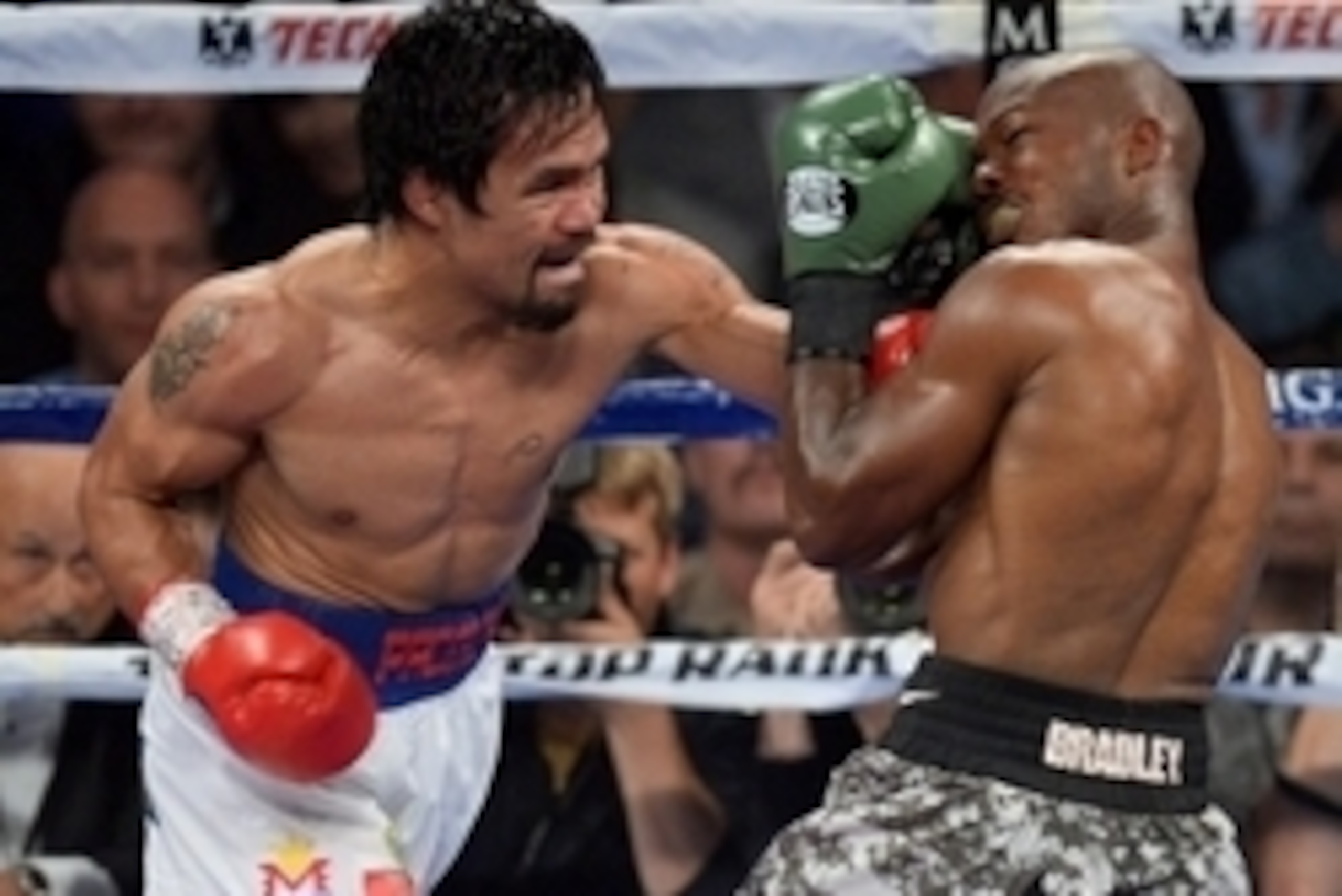 Apr 12, 2014; Las Vegas, NV, USA; Timothy Bradley (green gloves) and Manny Pacquiao (red gloves) box during their WBO World Welterweight Title bout at MGM Grand Garden Arena. Pacquiao won via unanimous decision. Mandatory Credit: Joe Camporeale-USA TODAY 