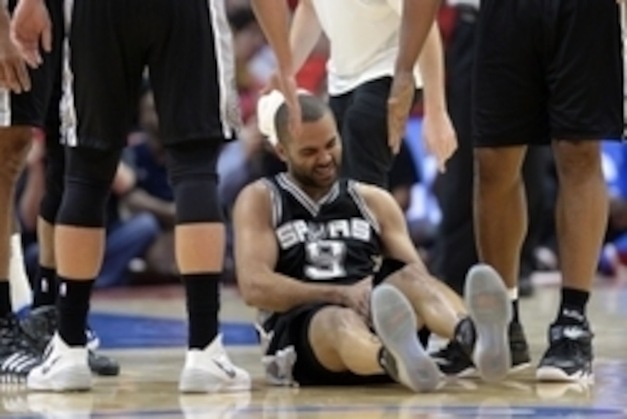 Apr 19, 2015; Los Angeles, CA, USA; San Antonio Spurs guard Tony Parker (9) reacts to an injury during the second quarter against the Los Angeles Clippers in game one of the first round of the NBA Playoffs at Staples Center. Mandatory Credit: Richard Mack