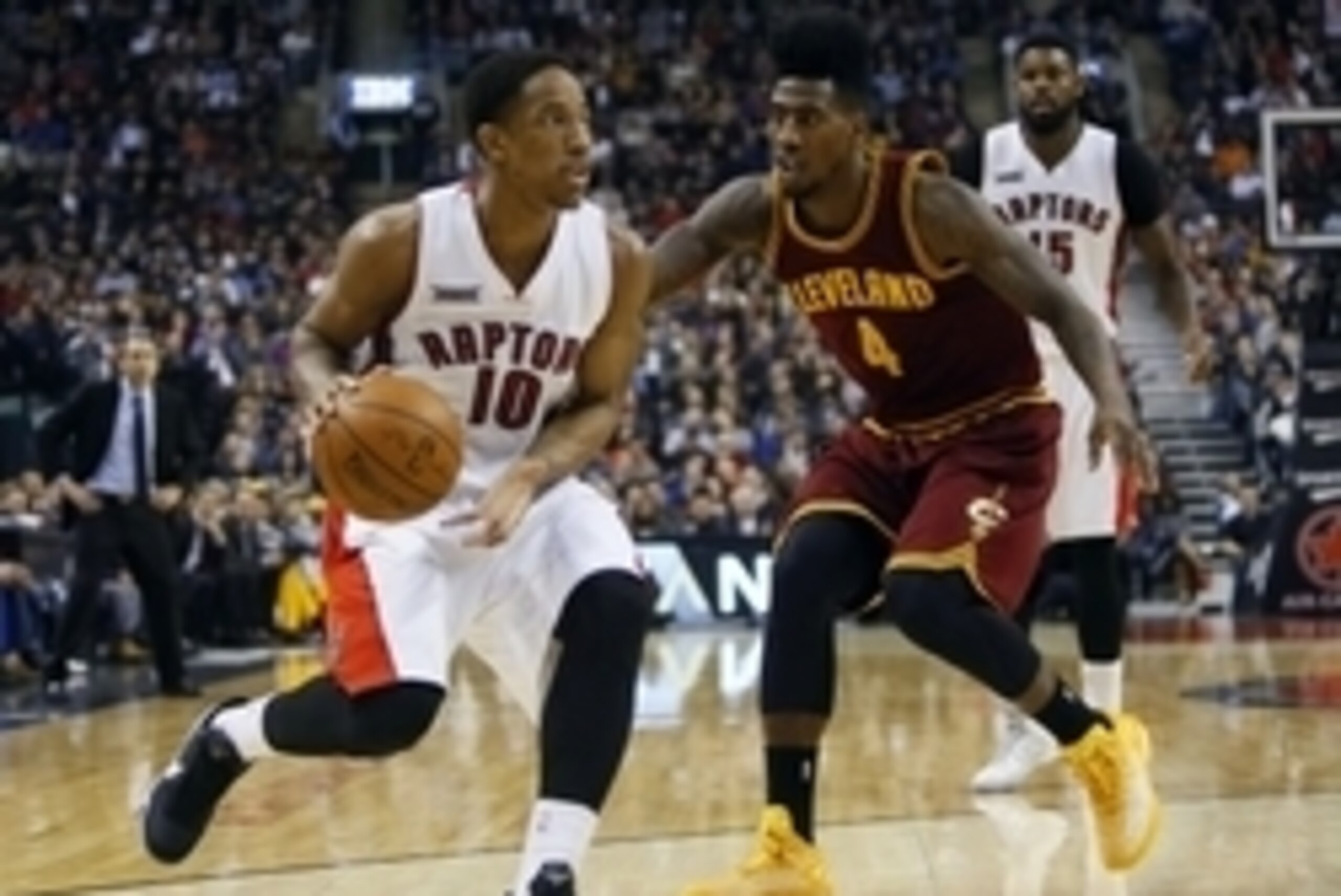 Mar 4, 2015; Toronto, Ontario, CAN; Toronto Raptors guard DeMar DeRozan (10) goes to pass as Cleveland Cavaliers guard Iman Shumpert (4) defends at the Air Canada Centre. Cleveland defeated Toronto 120-112. Mandatory Credit: John E. Sokolowski-USA TODAY S