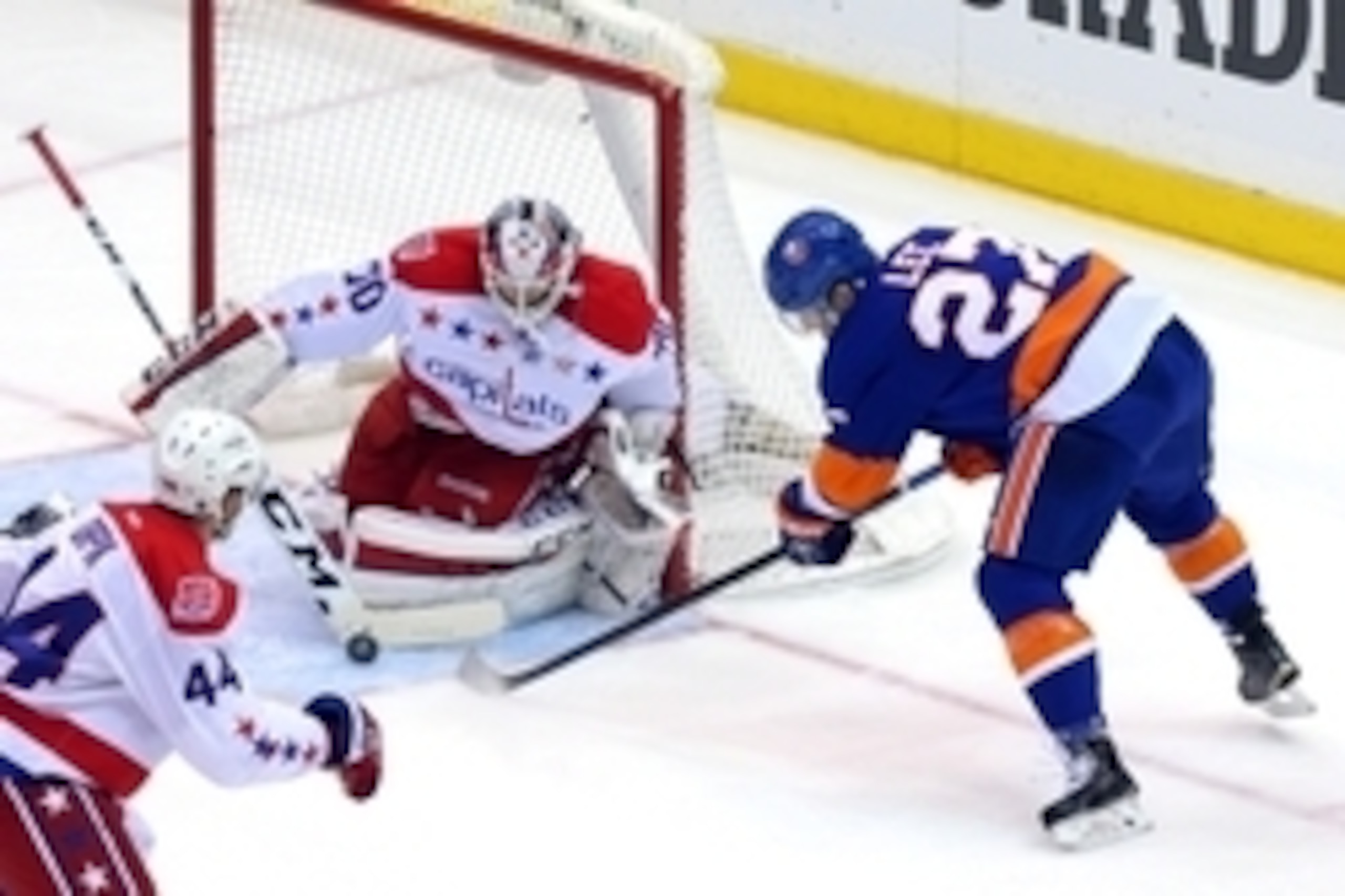Apr 21, 2015; Uniondale, NY, USA; Washington Capitals goalie Braden Holtby (70) makes a save against New York Islanders center Anders Lee (27) during the first period of game four of the first round of the 2015 Stanley Cup Playoffs at Nassau Veterans Memo Apr 21, 2015; Uniondale, NY, USA; Washington Capitals goalie Braden Holtby (70) makes a save against New York Islanders center Anders Lee (27) during the first period of game four of the first round of the 2015 Stanley Cup Playoffs at Nassau Veterans Memo