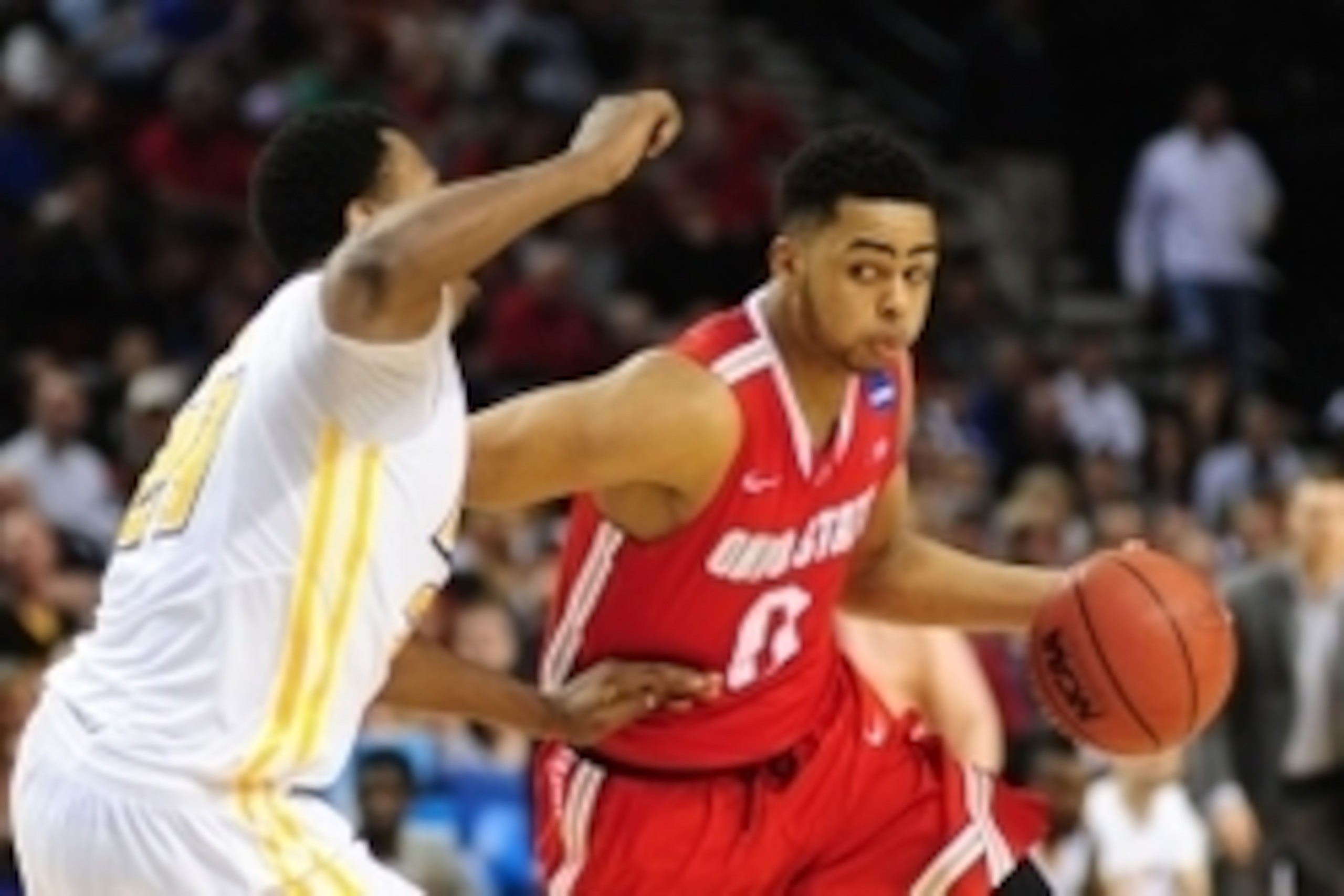 Mar 19, 2015; Portland, OR, USA; Ohio State Buckeyes guard D'Angelo Russell (0) dribbles against Virginia Commonwealth Rams guard/forward Treveon Graham (21) during the first half in the second round of the 2015 NCAA Tournament at Moda Center. Mandatory C