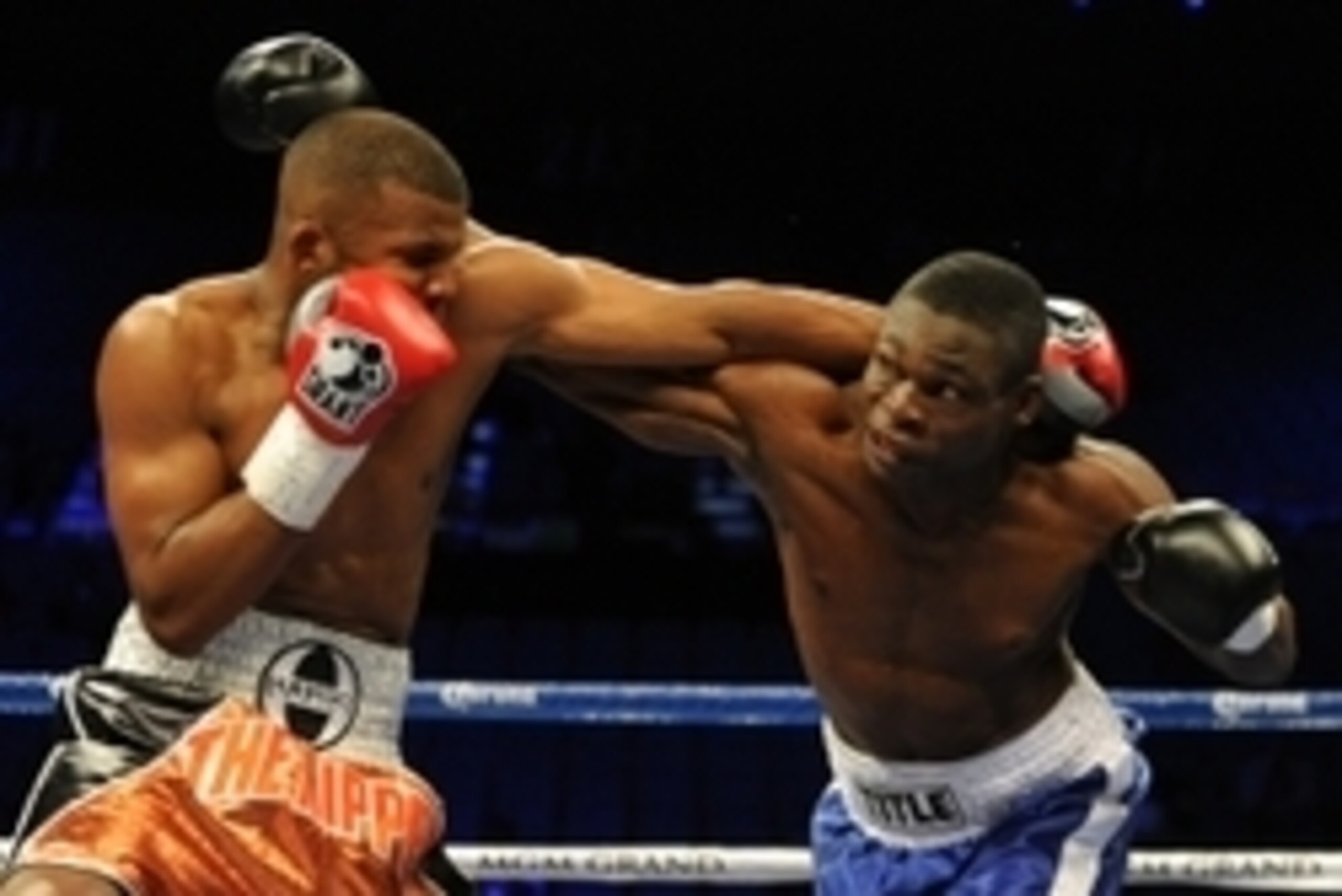 May 4, 2013; Las Vegas, NV, USA; Badou Jack  (red gloves) and Michael Gbenga (blue gloves) during their Light Heavyweight fight at the MGM Grand Garden Arena. Mandatory Credit: Jayne Kamin-Oncea-USA TODAY Sports